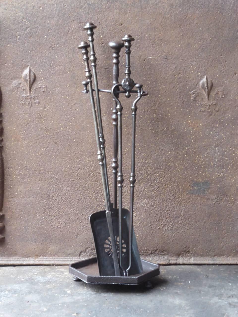 19th century English Victorian fireplace tool set - fire tools made of wrought iron.

We have a unique and specialized collection of antique and used fireplace accessories consisting of more than 1000 listings at 1stdibs. Amongst others, we always