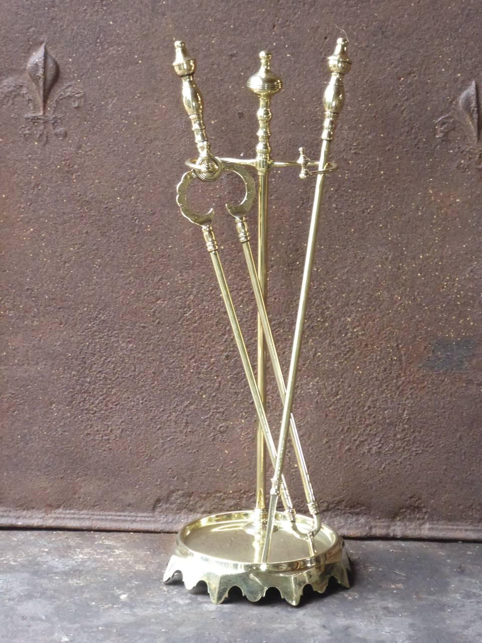 19th century English Victorian fireplace tool set, companion set made of polished brass.

We have a unique and specialized collection of antique and used fireplace accessories consisting of more than 1000 listings at 1stdibs. Amongst others, we