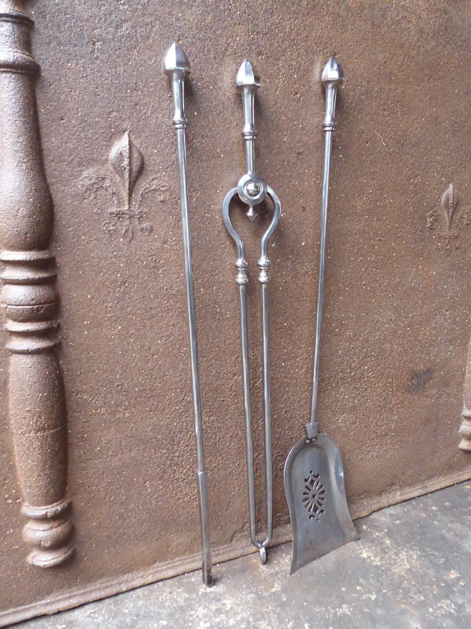 19th century English Victorian fireplace tool set made of polished steel.

We have a unique and specialized collection of antique and used fireplace accessories consisting of more than 1000 listings at 1stdibs. Amongst others, we always have 300+