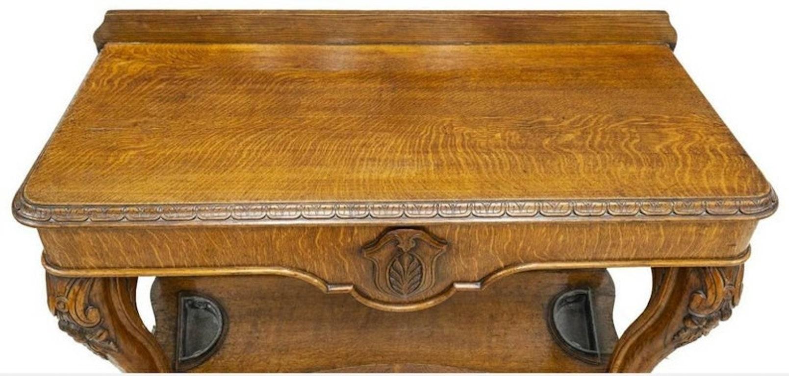 A stunning and rare, finely crafted, Victorian era hand carved golden tiger oak entryway statement table. Placed in the entry, hall or parlor, this over sized table was sure to impress any guest stopping by. Handcrafted in England during the second