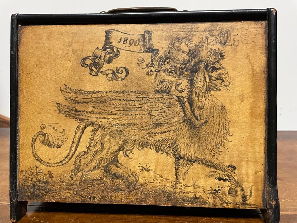 Unusual 19th century letter box with whimsical ink decoration inside and out, signed and dated 1890. With wonderfully naive ink decoration, including a Chimera being ridden by a sprite blowing an elaborate horn. Also a lovely small Dutch style