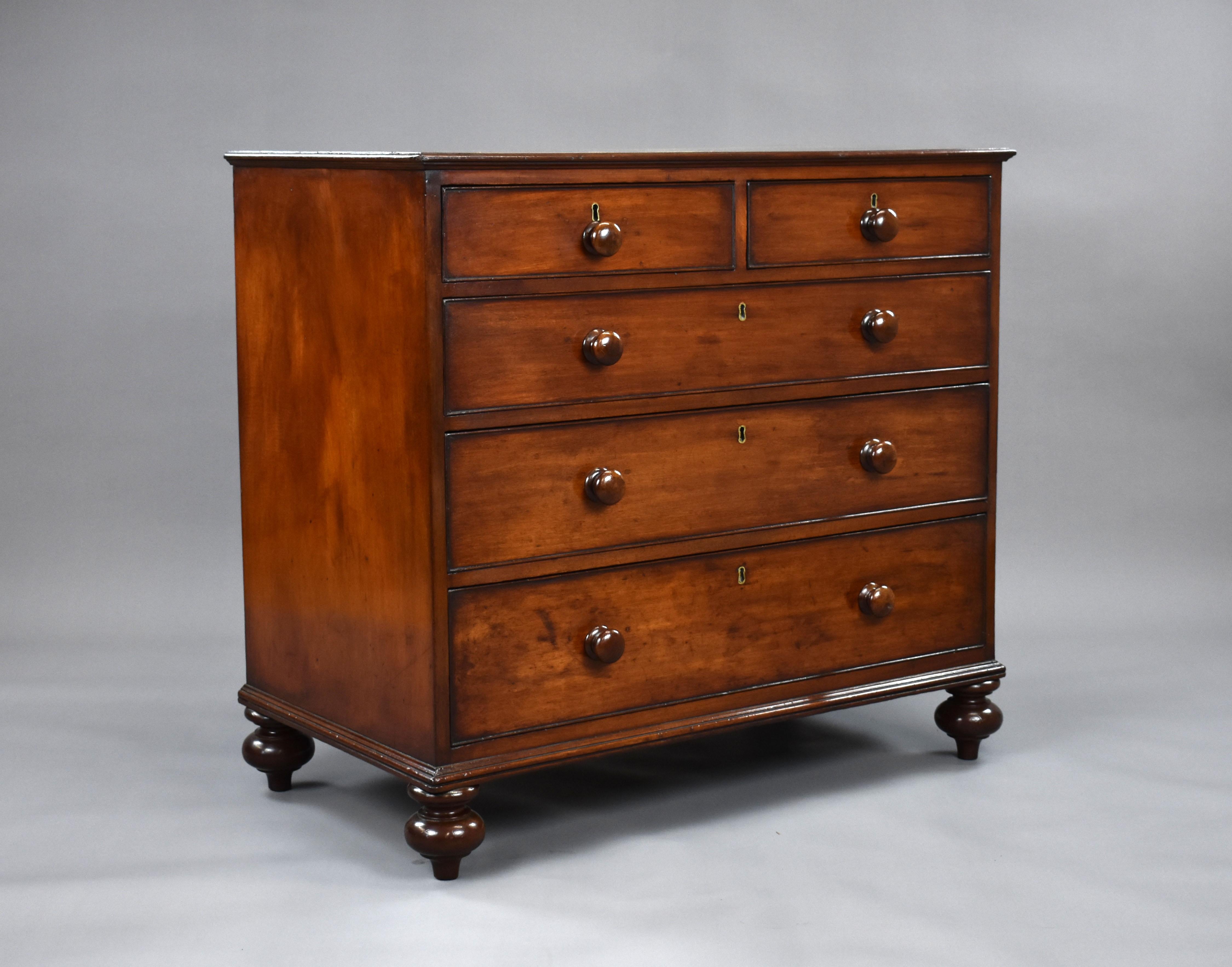 A good quality Victorian mahogany chest of drawers, having an arrangement of two short over three long graduated drawers, each with turned handles. The chest stands on turned feet and is in very good condition for its age. 

Measures: Width: 96cm
