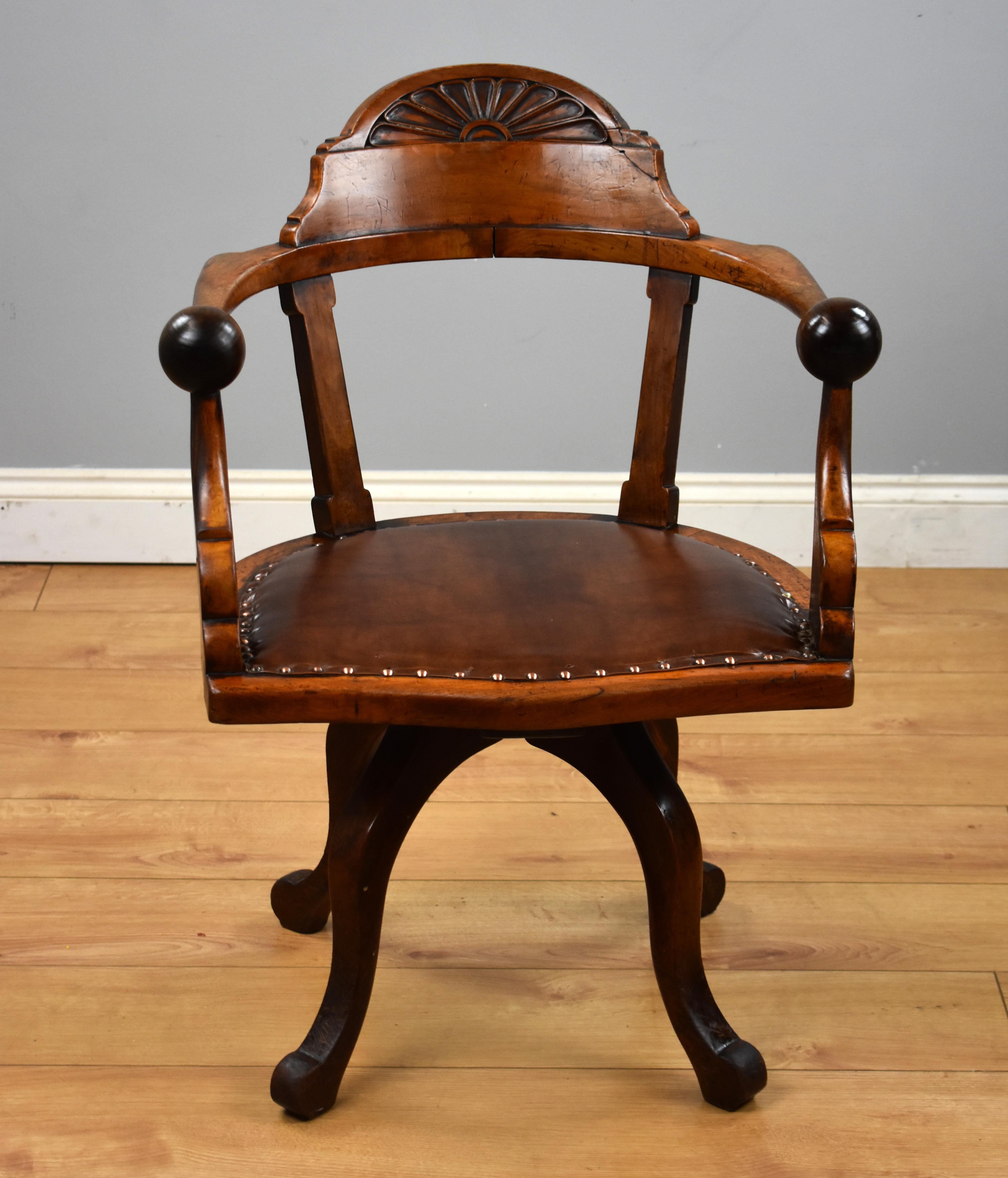 For sale is a Victorian mahogany desk chair, in the Arts & Crafts style, revolving and with four down swept legs terminating on scroll feet.

Measures: Width 24