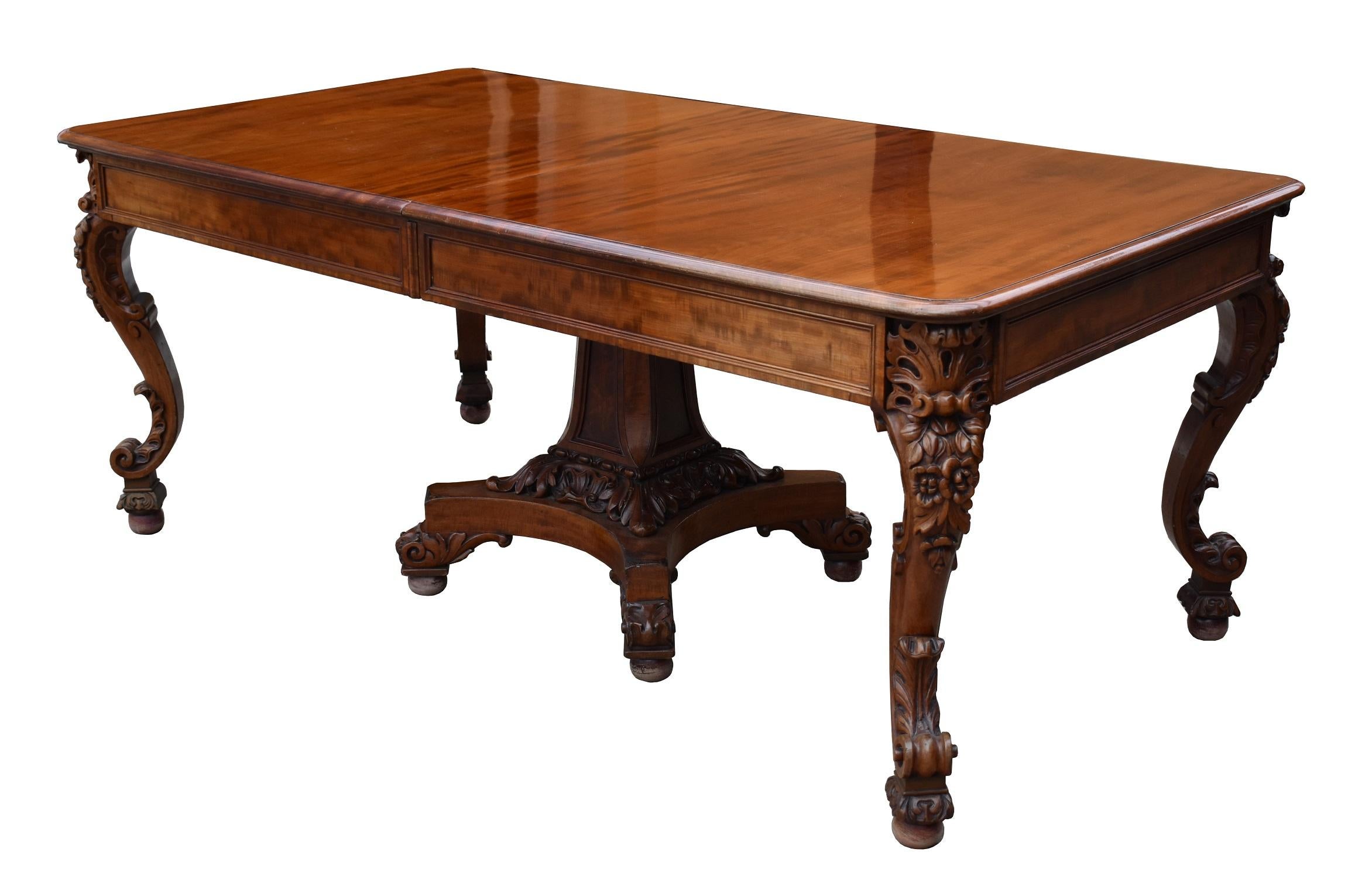 For sale is a very unusual Victorian mahogany extending dining table. The table is raised on four elegantly carved legs and the centre is supported by an exquisitely carved centre pedestal, which is a most unusual feature for a Victorian table. This