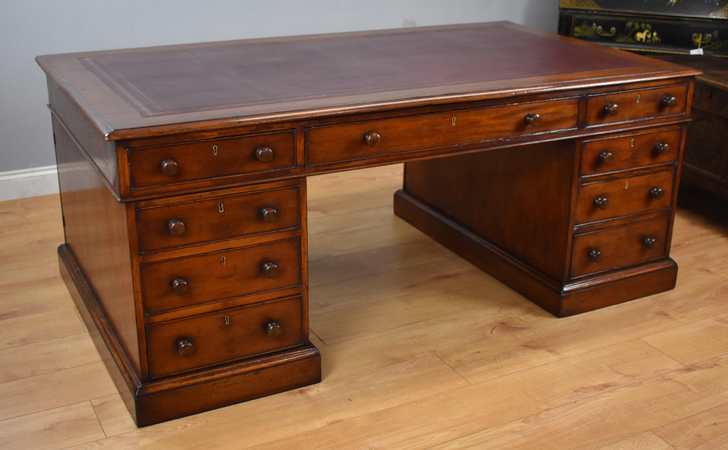 For sale is a good quality Victorian mahogany partners desk. The top inset with a maroon leather, decorated with blind and gold tooling, above three drawers to the front (two short, with one long drawer in the centre) with the same combination on