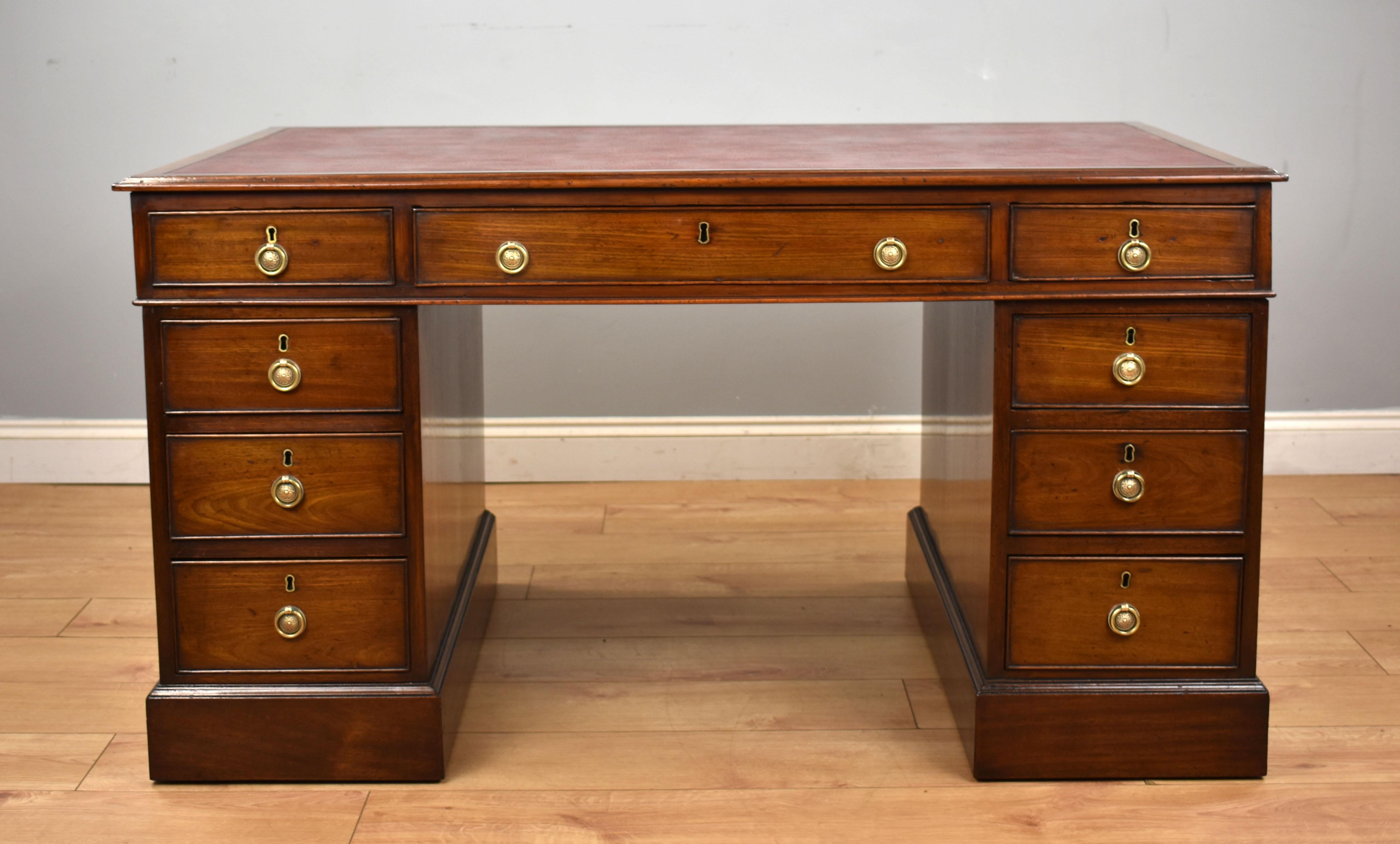 For sale is a Victorian mahogany partners desk, having a faux leather writing surface above three drawers and a further three drawers on the opposing side. The top fits onto two pedestals, each pedestal with three drawers to the front and cupboards
