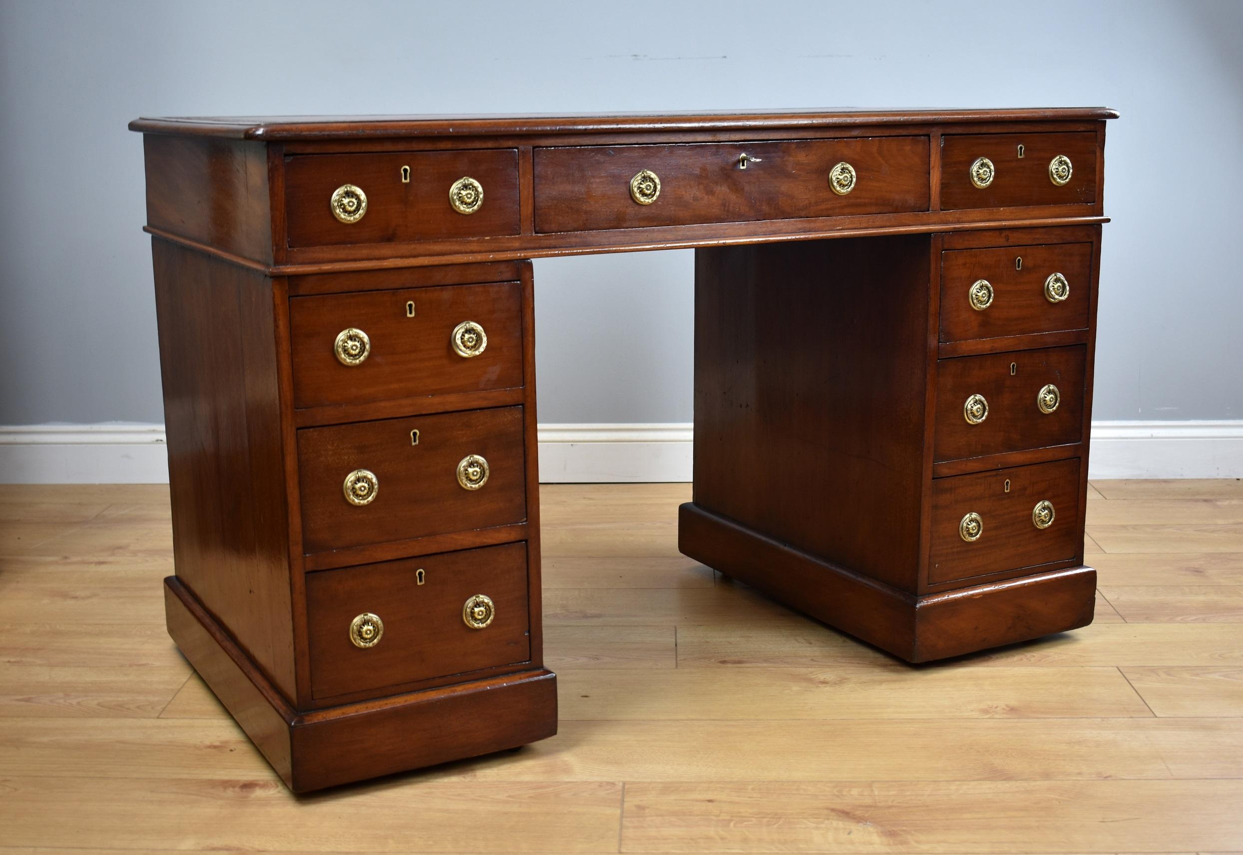 For sale is a good quality Victorian mahogany pedestal desk, the top inset with a red leather skiver, decorated with gold and blind tooling. Below this the top has an arrangement of three drawers, one long to the centre flanked by a short drawer on