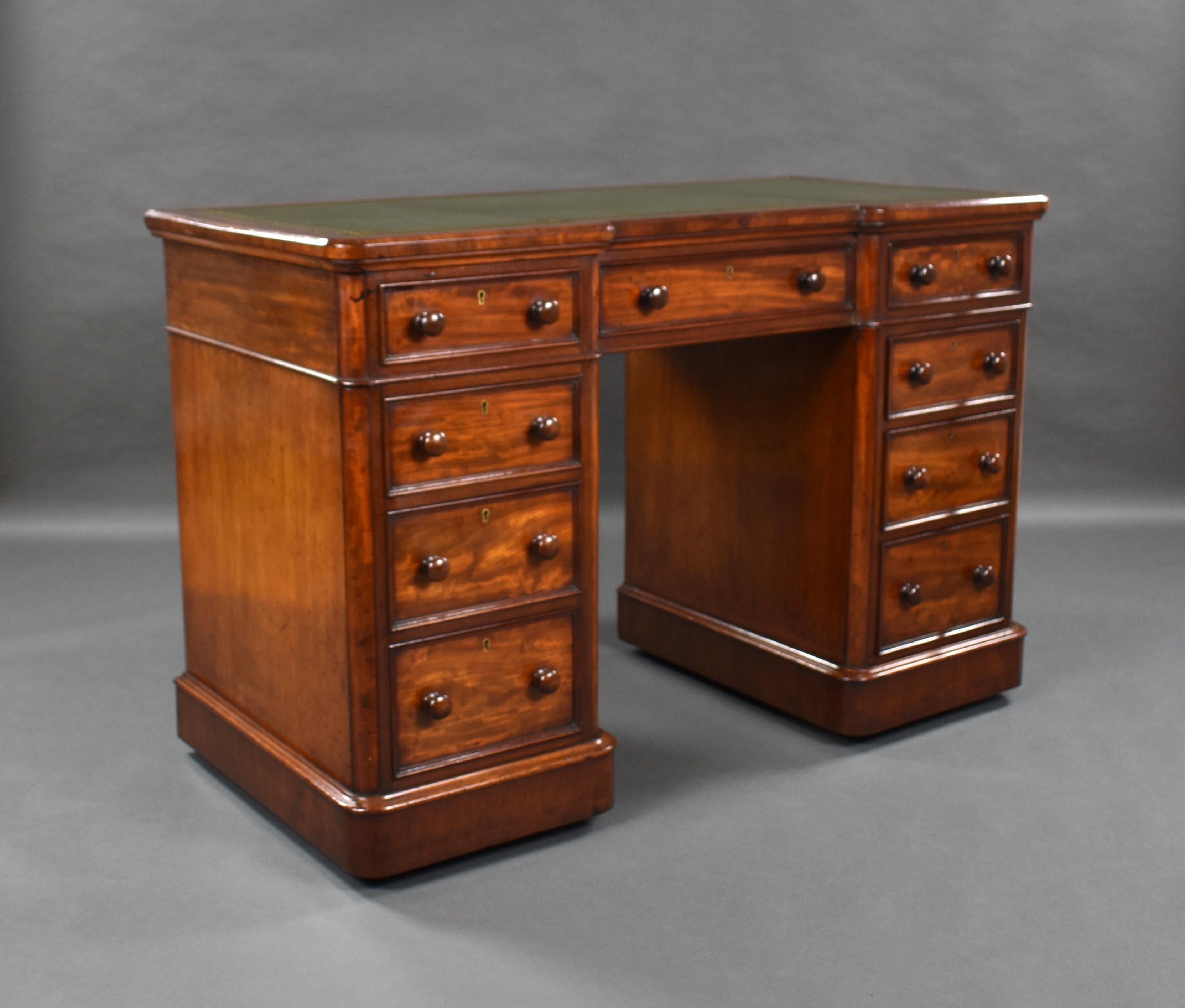 For sale is a good quality Victorian mahogany pedestal desk, having a green leather writing surface, decorated with blind and gold tooling, above three drawers, each turned handles. The top fits on to two pedestals each with a further three