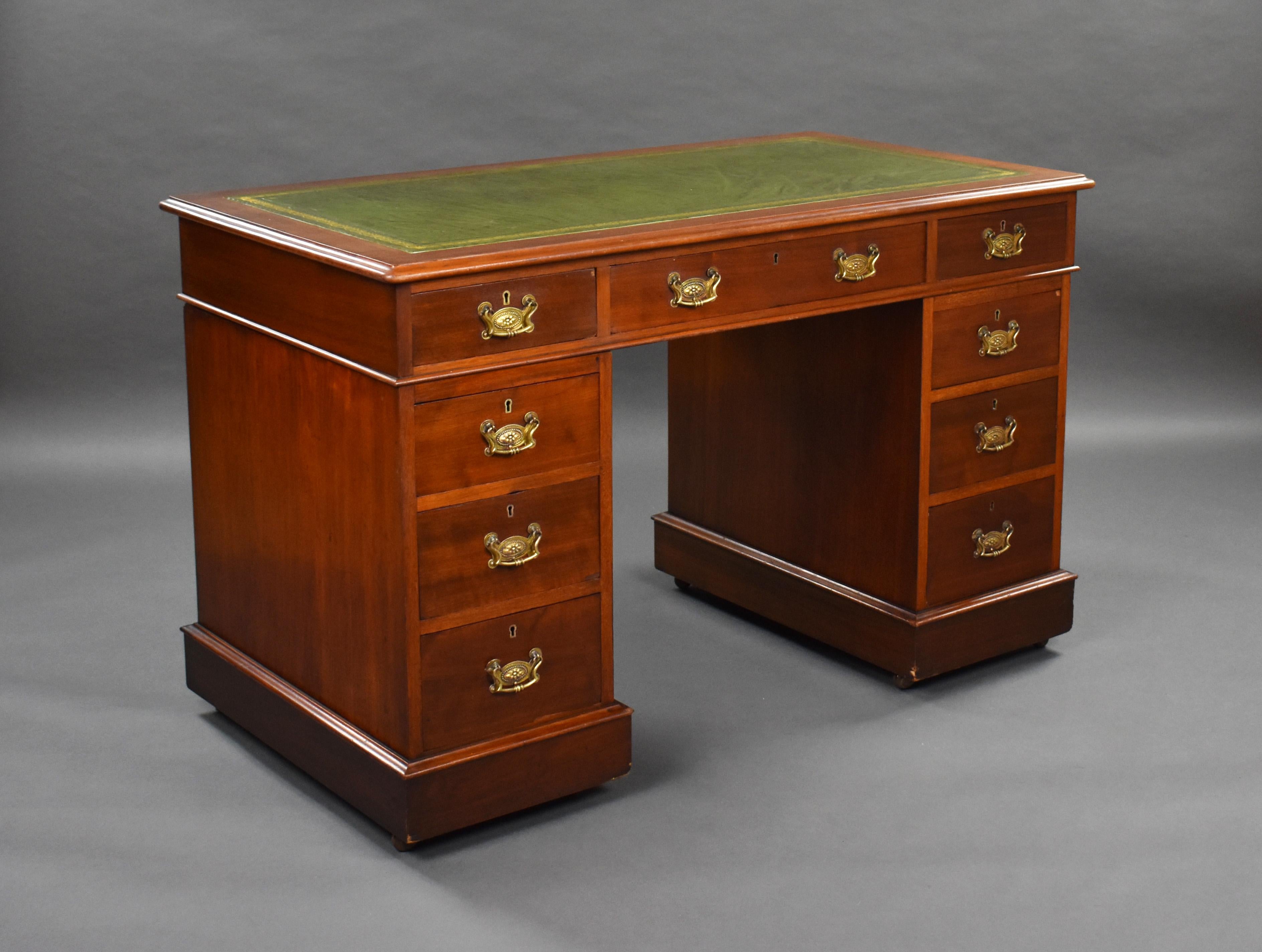 For sale is a Victorian mahogany pedestal desk, having a green leather skiver writing surface, decorated with gold tooling, above three drawers. The top fits onto two pedestals, each with a further three drawers, above plinth bases raised on