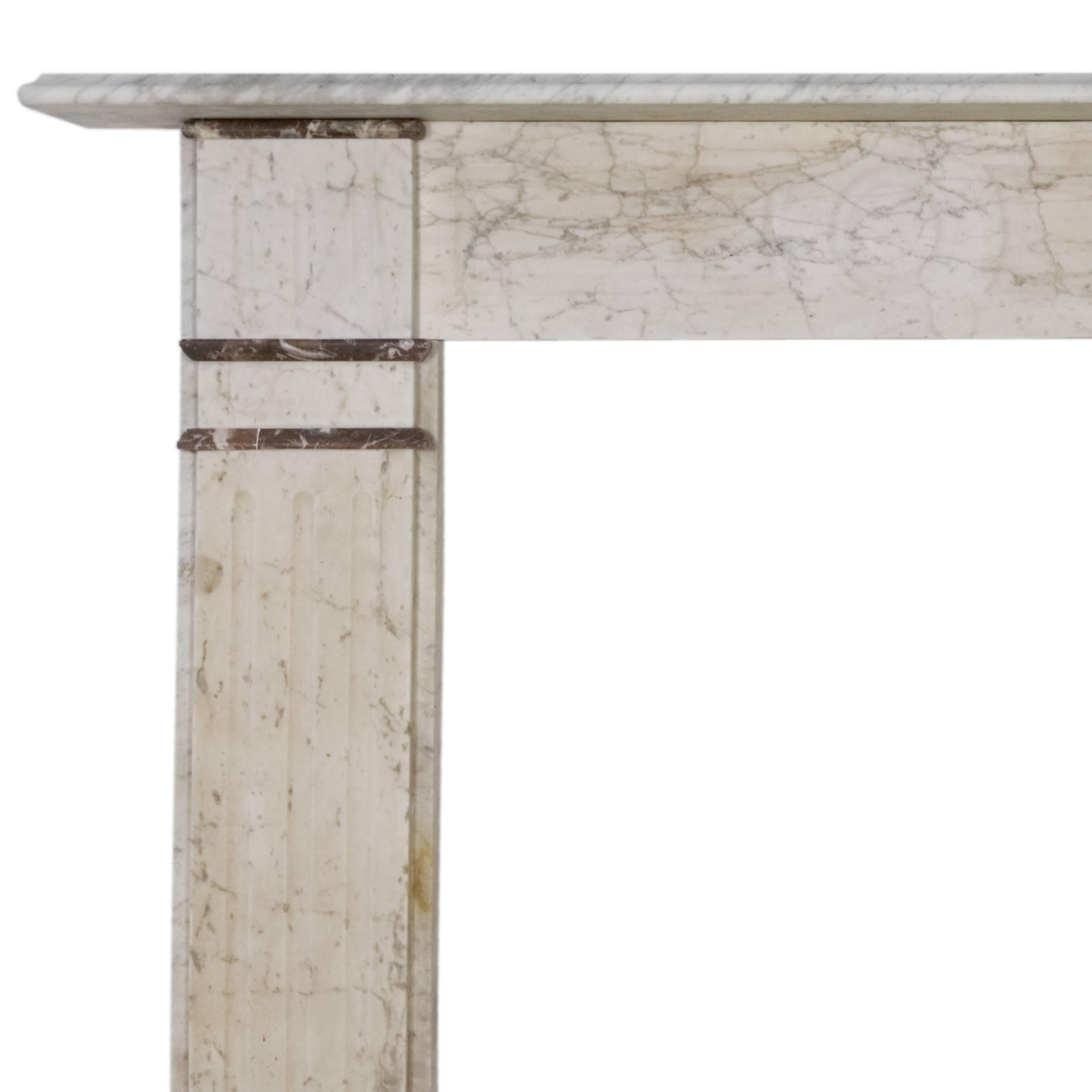 19th century English Victorian marble fireplace surround with fluted legs.
Slight smoke stains which is reflected in price.

Shelf width 56 3/4