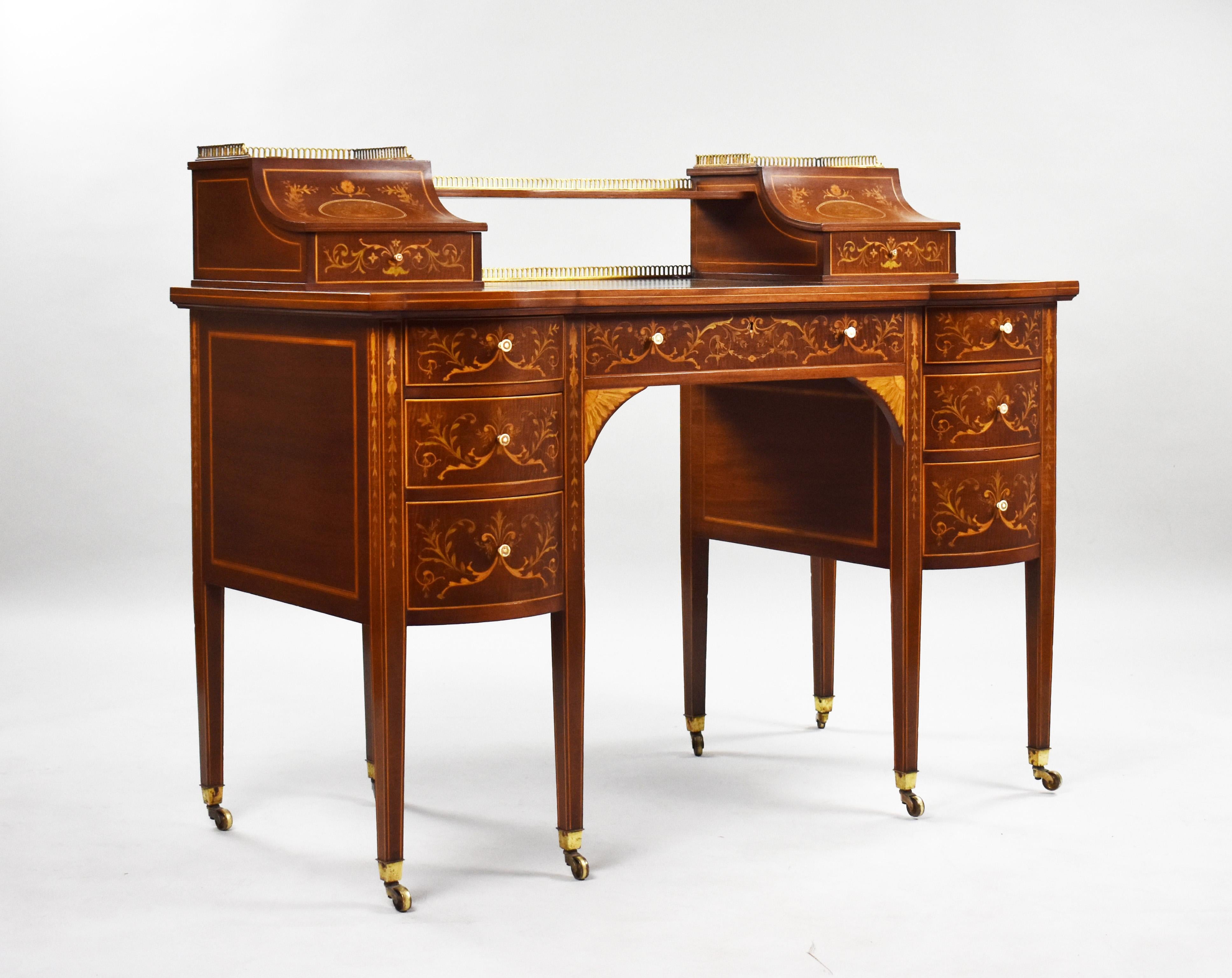 For sale is a top quality Victorian Sheraton revival marquetry inlaid carlton house desk attributed to Edwards & Roberts. The top having to marquetry inlaid boxes above single drawers flanked a hand coloured leather skiver decorated with gold
