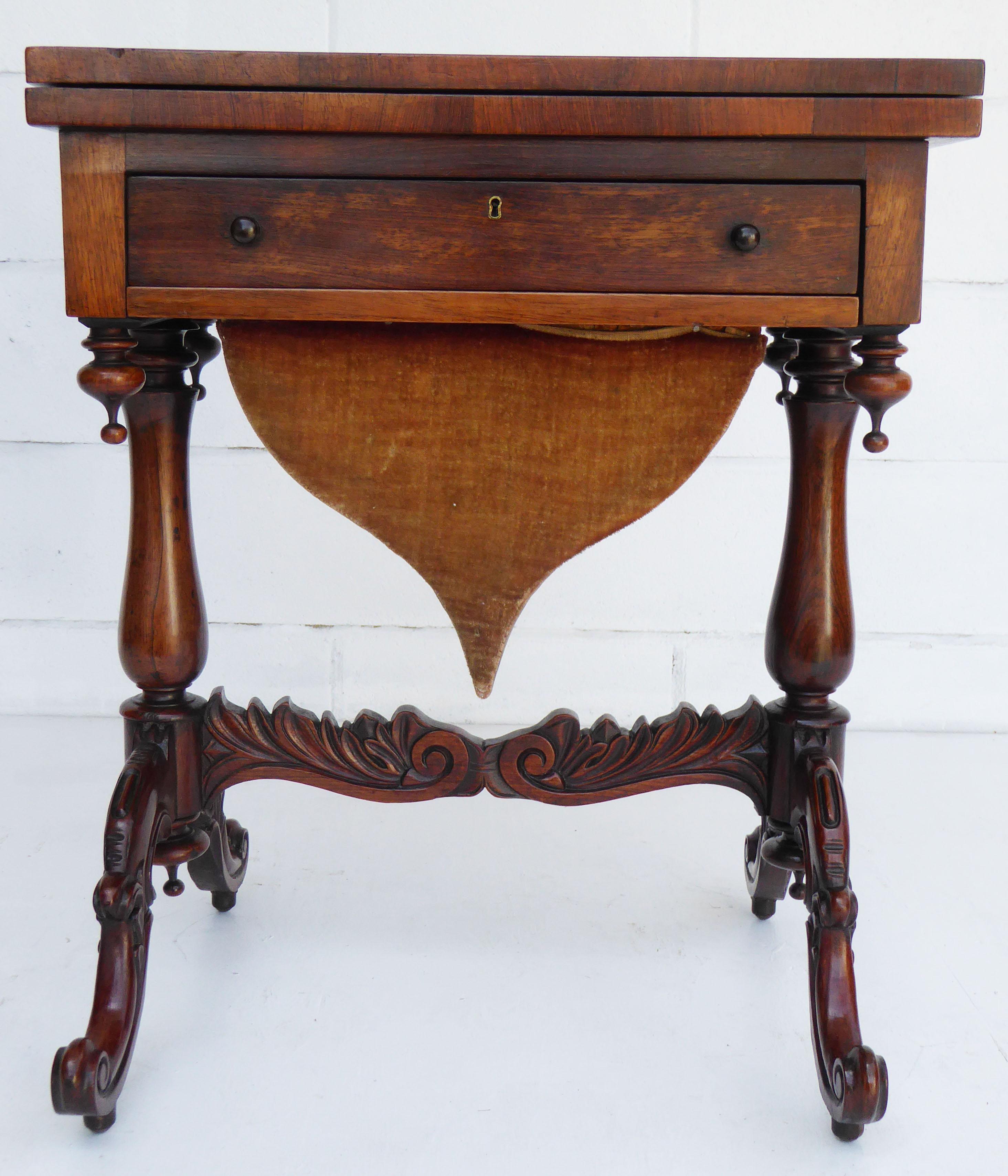For sale is a good quality Victorian rosewood games table. The table has an inlaid top which swivels and folds over to reveal a chess board and backgammon. Below this is a single fitted drawer, for sewing utensils. This is above a large pullout /