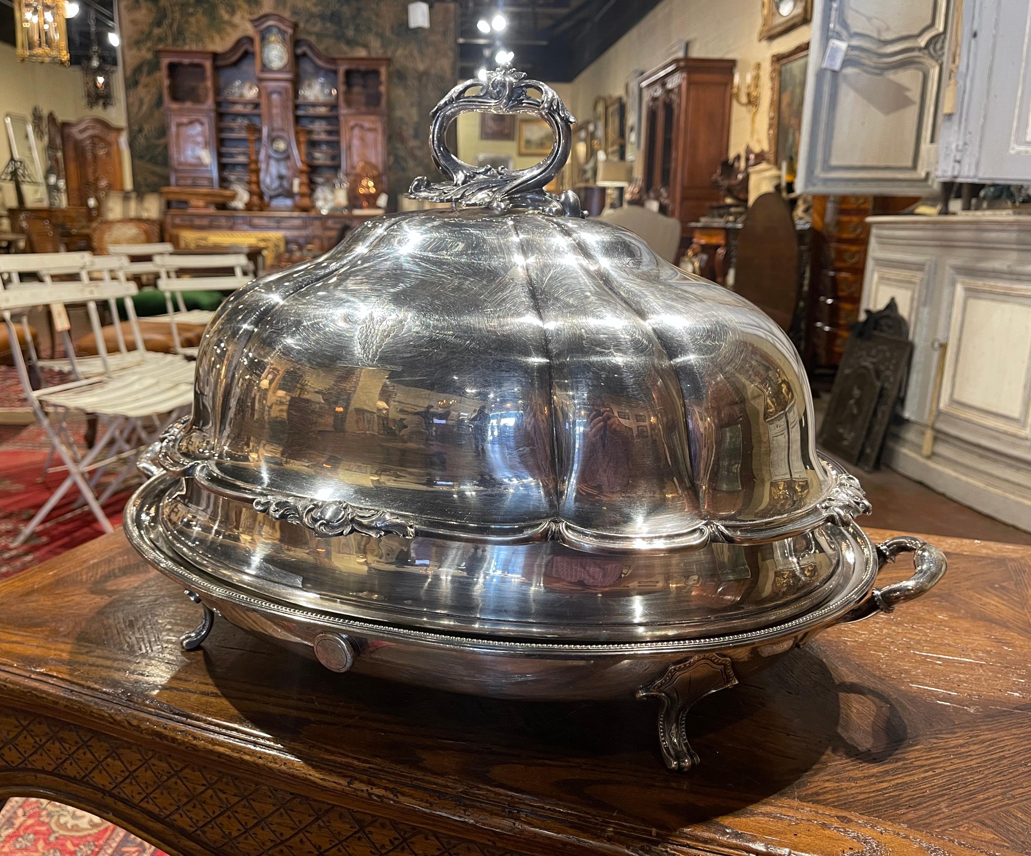This elegant two-piece antique copper well tree with warming jacket, with meat cover dome was created in England, circa 1860. Likely manufactured by Sheffield, and standing on curved legs, the platter with integral warming jacket, is dressed with