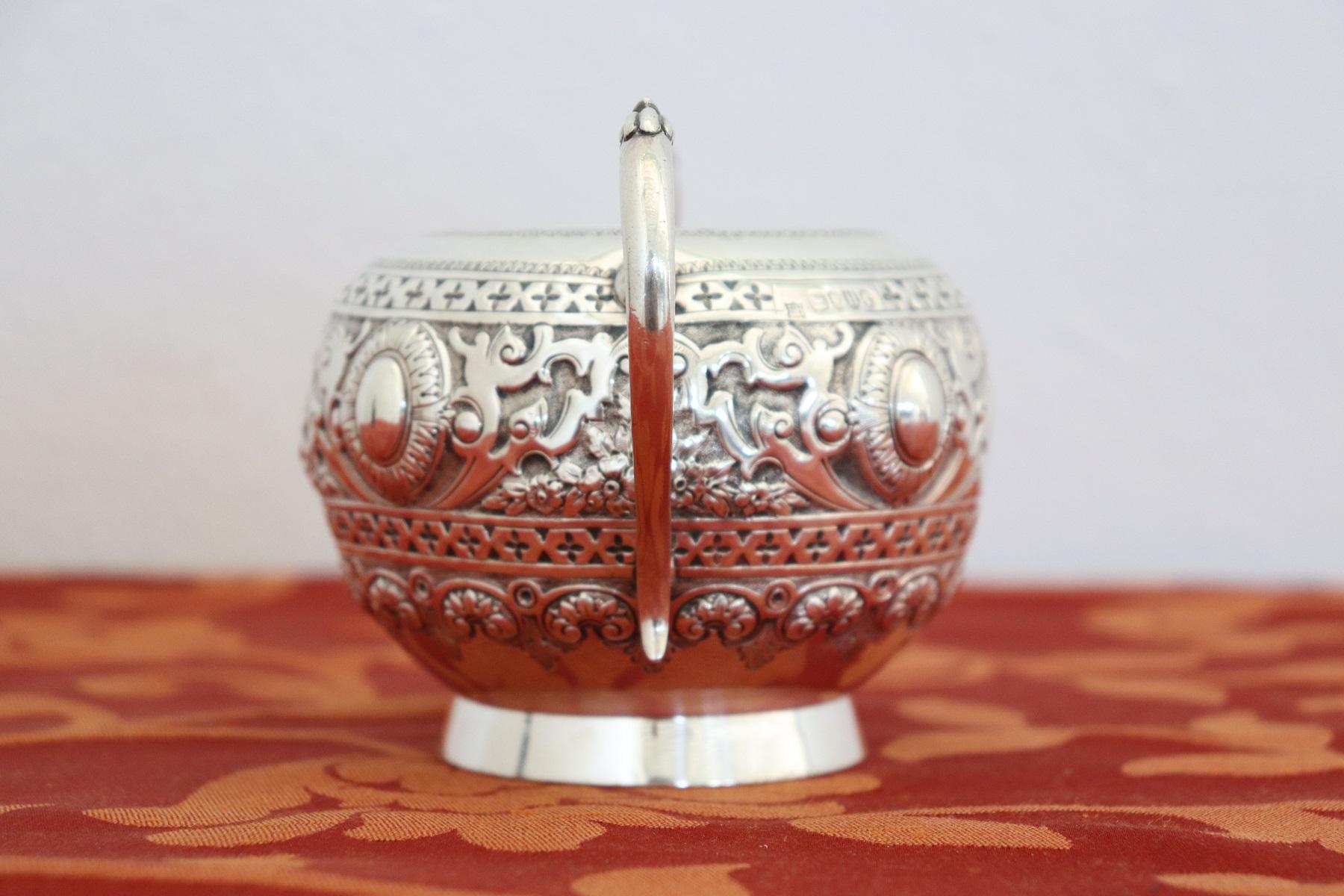 20th century English Victorian sterling silver bowl with handles, 1883s. The whole body is finely ornamented. The regular series of markings imprinted in line on the object, places the execution in Great Britain. It was made of 925/1000 silver and