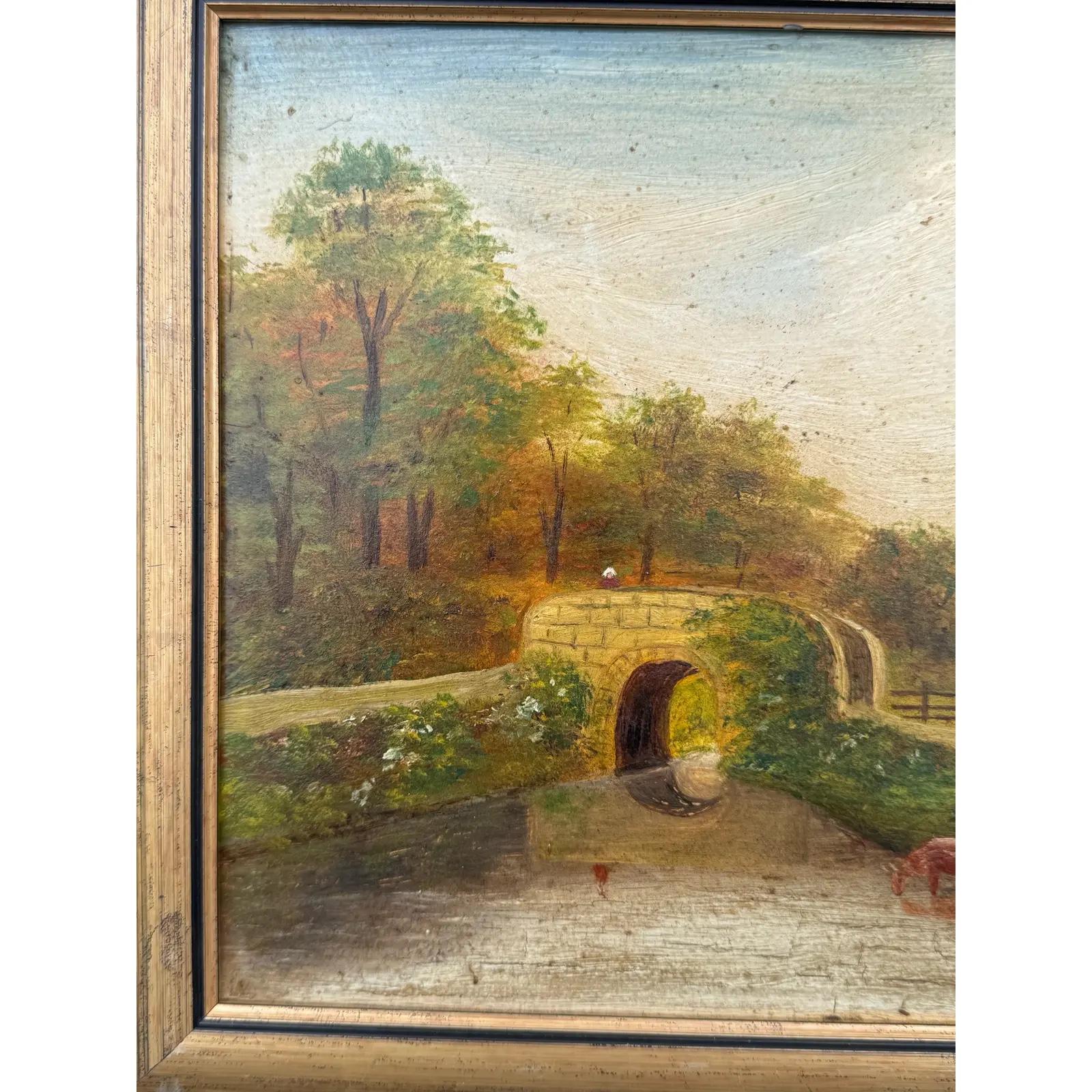 Provenant de l'Angleterre du XIXe siècle, cette huile sur toile originale apporte une image apaisante à n'importe quelle pièce. Un vieux pont de pierre enjambe une rivière tranquille par une journée ensoleillée. Deux vaches vont s'abreuver à la