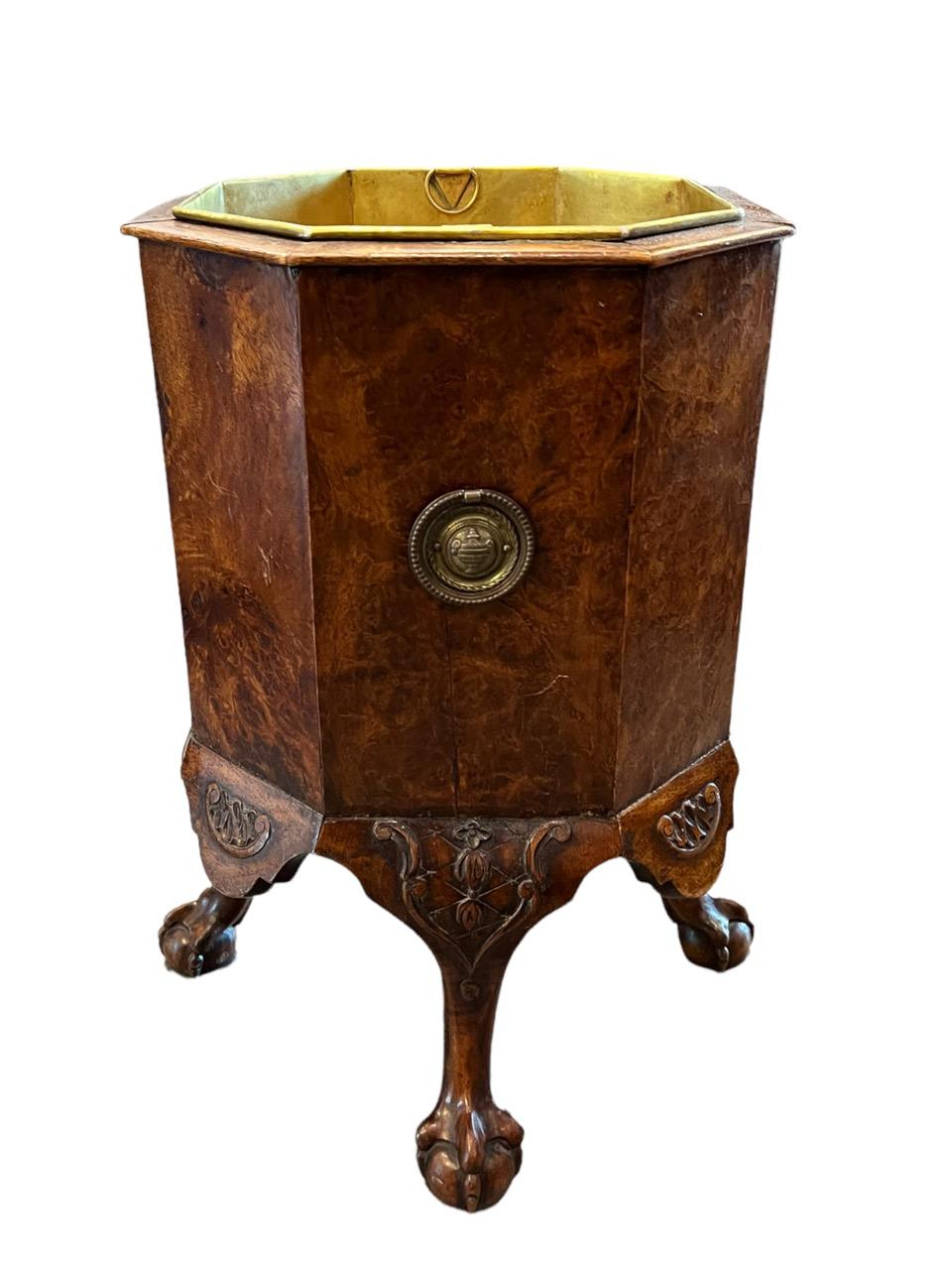 Late 19th century English walnut and burl wood Chippendale jardiniere ode to a bygone era. It is hand-carved from luxurious which features a stylized relief carving on the boldly scrolled legs that displays an obvious Baroque style