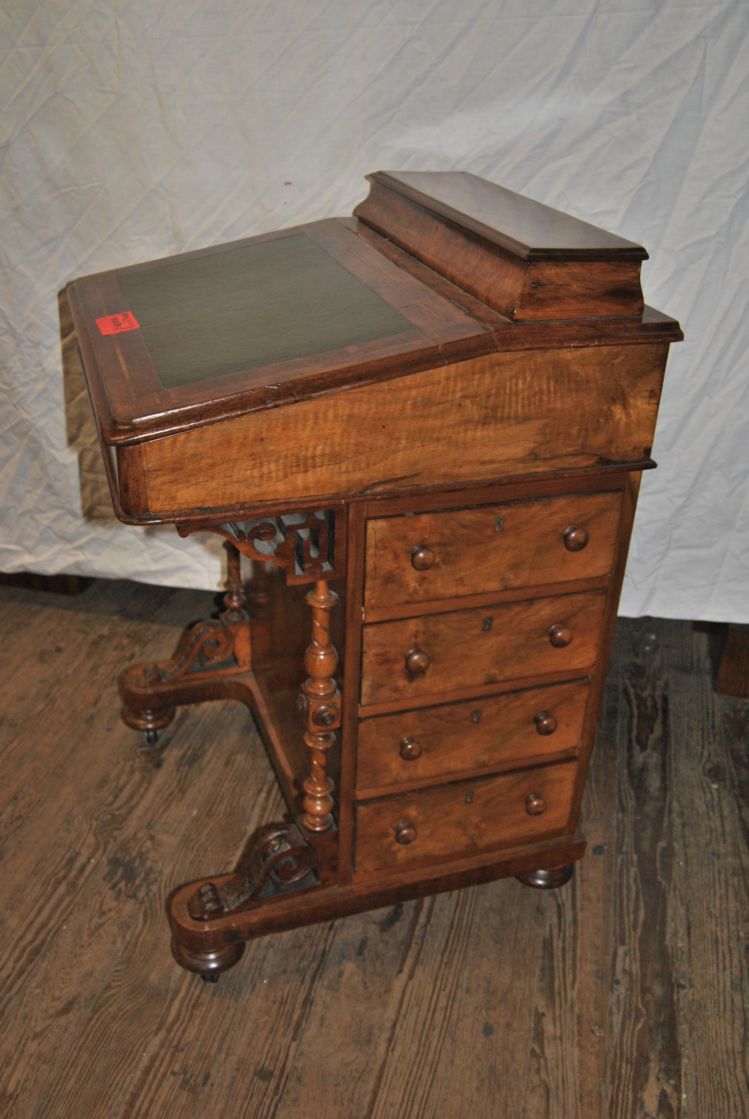 This is a Walnut Inlaid Davenport Desk made in England, circa 1870. The top gallery has a nicely molded edge and opens to reveal 10 open cubby holes / dividers for storage of paper, pens, Ink Wells, etc. The Green Leather Top writing surface also