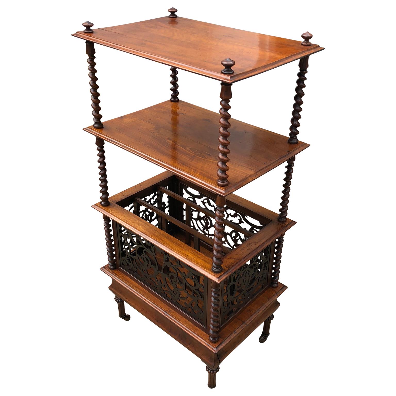 Mid-19th century English walnut ètagerè and music stand

Antique music stand / Etagere shelf, circa 1855-1860, made from walnut. The top is decorated with wooden finials and has two beveled edge shelves held with barley twist stiles over a