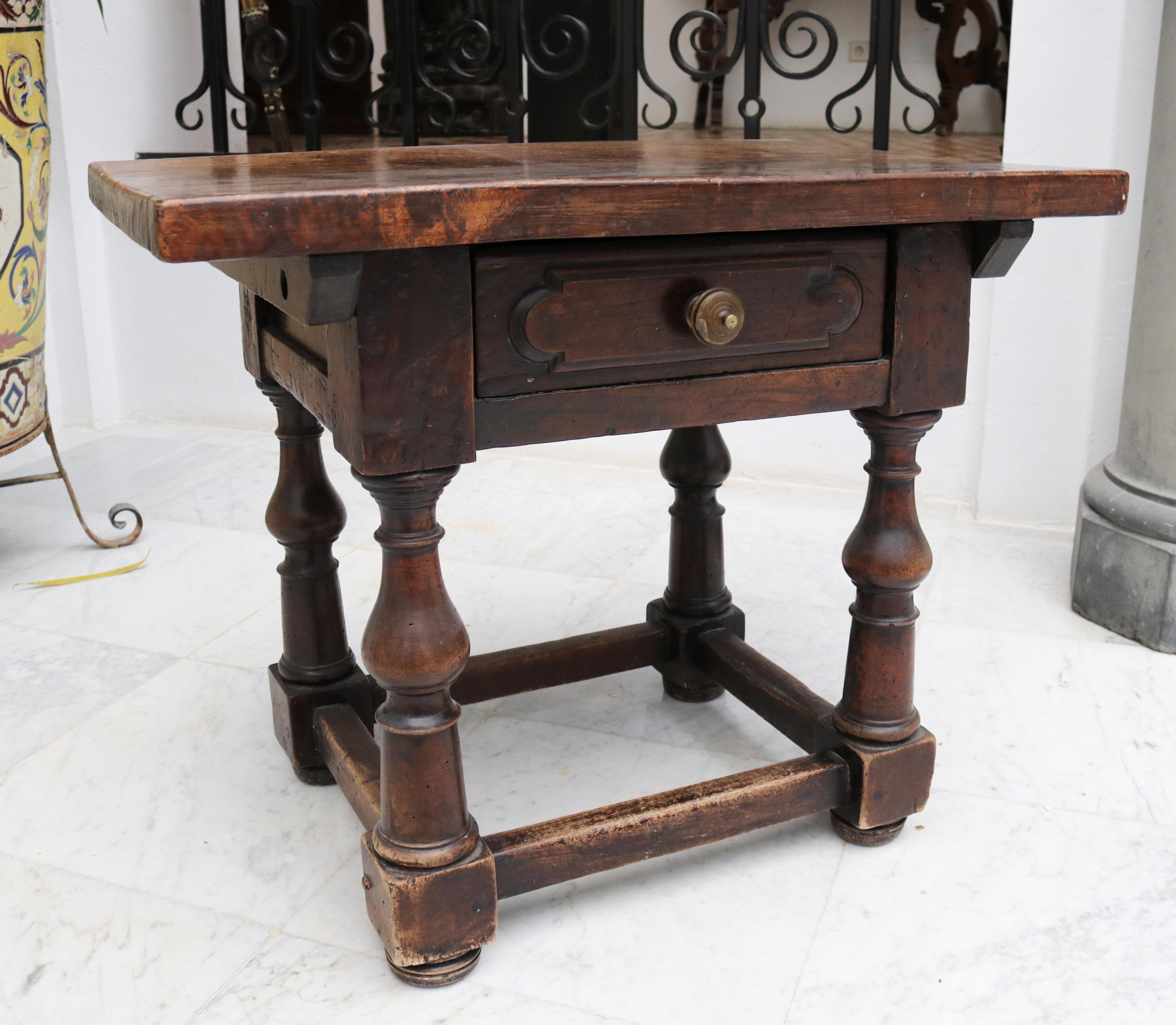 19th century English walnut one drawer side table with brass handle and feet in classical Renaissance balusters.
 
