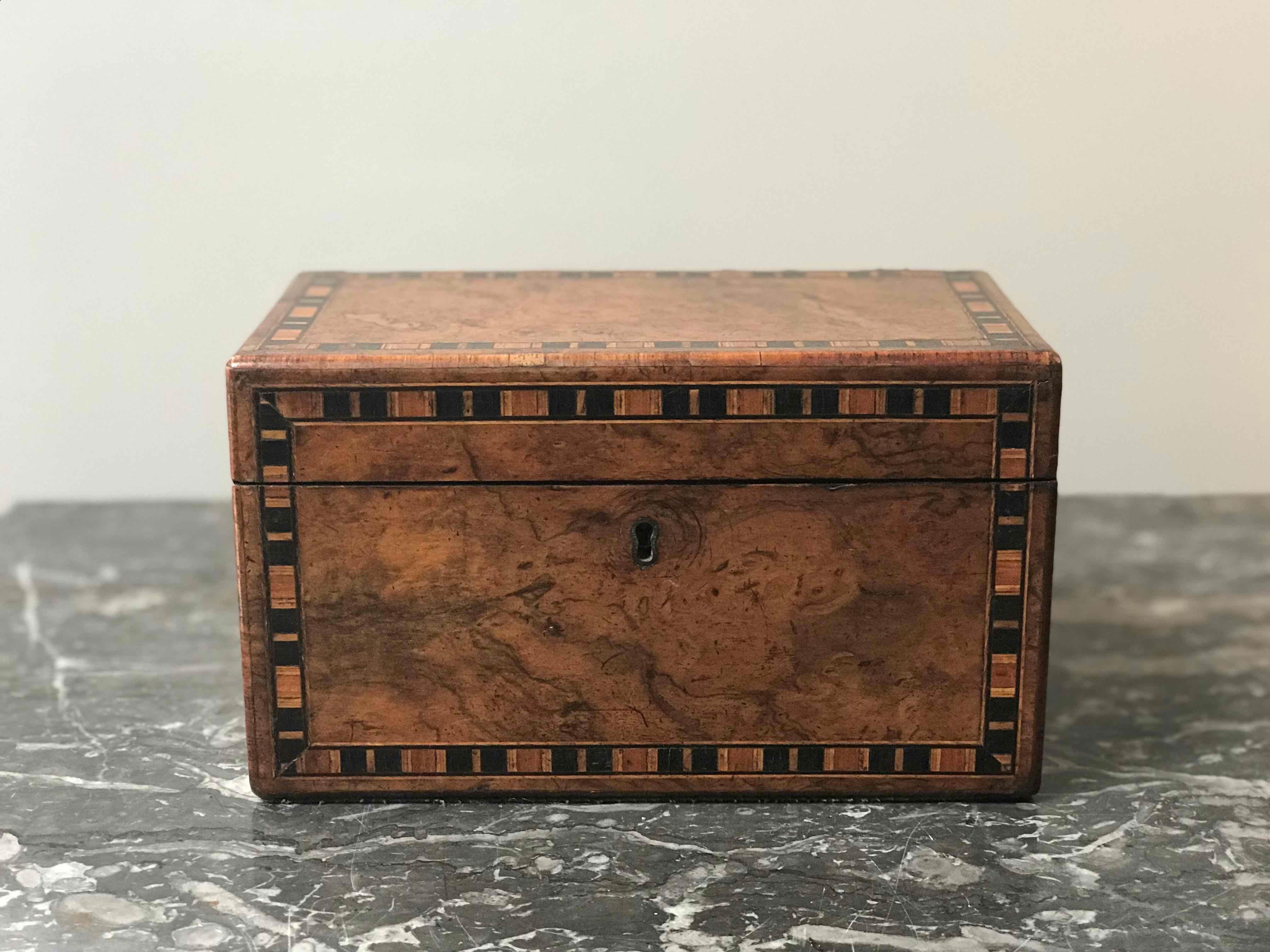 19th century English walnut tea caddy box with inlay. Tea caddy box has two storage compartments. 