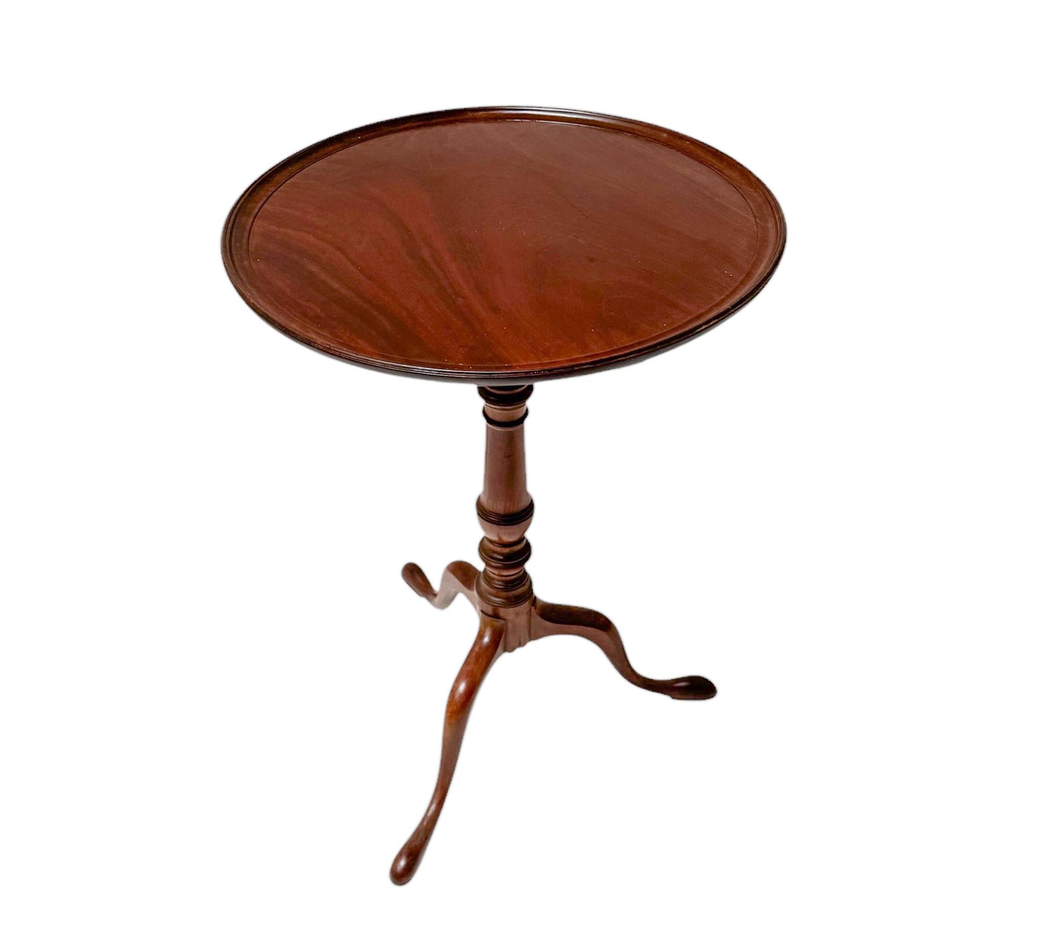 Stunning and elegant Queen Anne Style tilt-top end table.
Striking English design from the mid 19th Century.
The solid walnut top is attached to the solid walnut turned pedestal shaft via a large dowel set through a top plate fitted with a spring