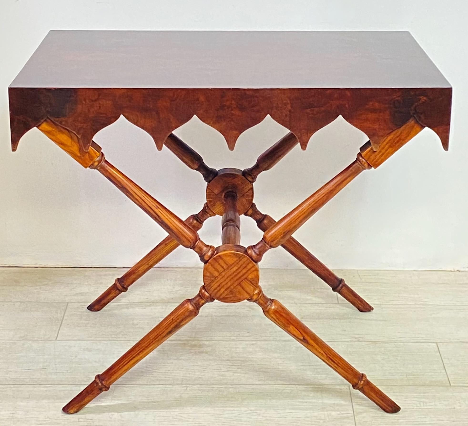 An unusual whimsical mid to late 19th century walnut side table. 
High figural walnut grain with an interesting exaggerated apron on a campaign style oak x stretcher base. 
This table was refinished and restored some time in the last quarter of