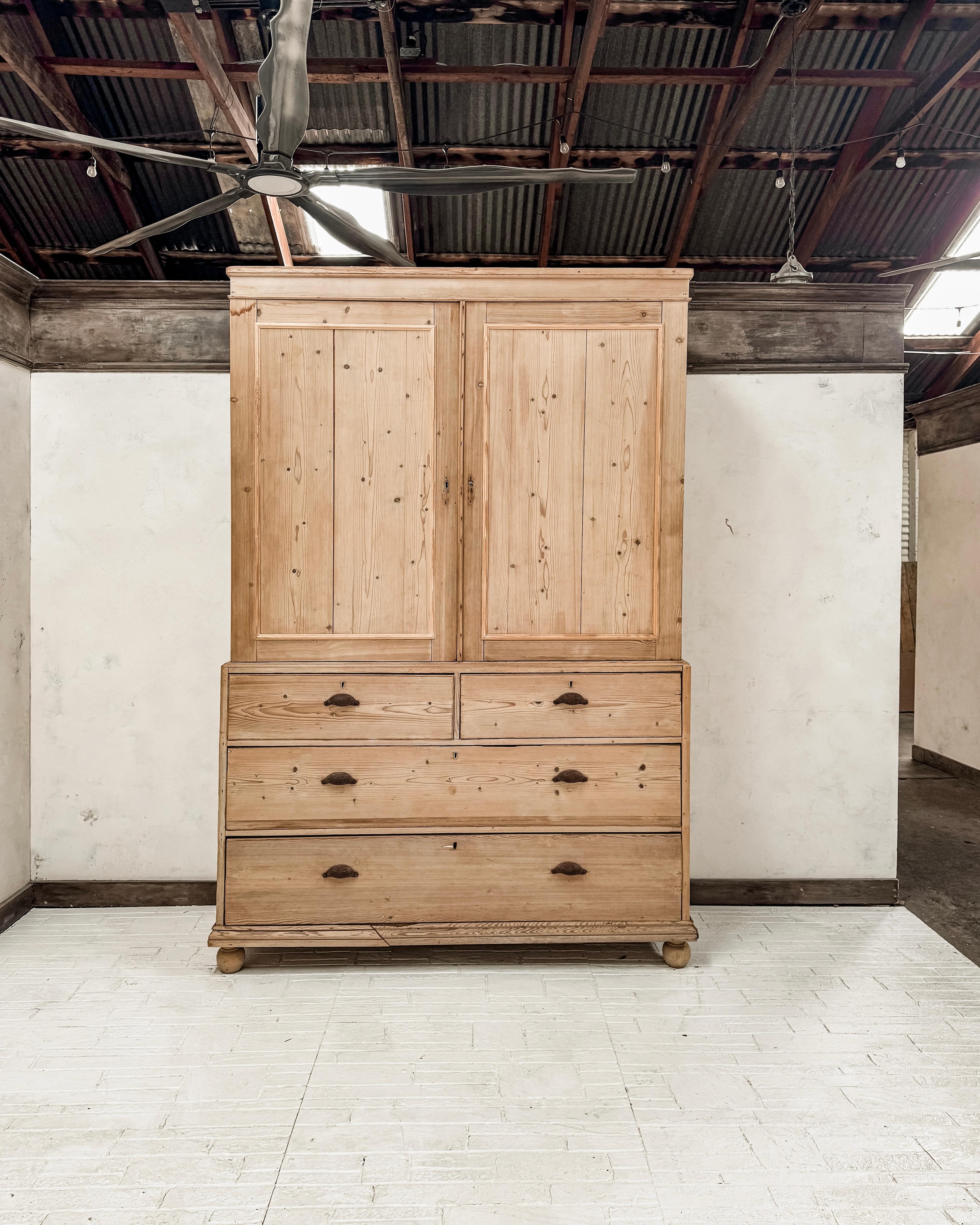 This charming white pine housekeeper's cupboard, dating from the mid to late 19th century, hails from England and embodies both practicality and understated sophistication. Designed for efficient storage and organization in a large household, the