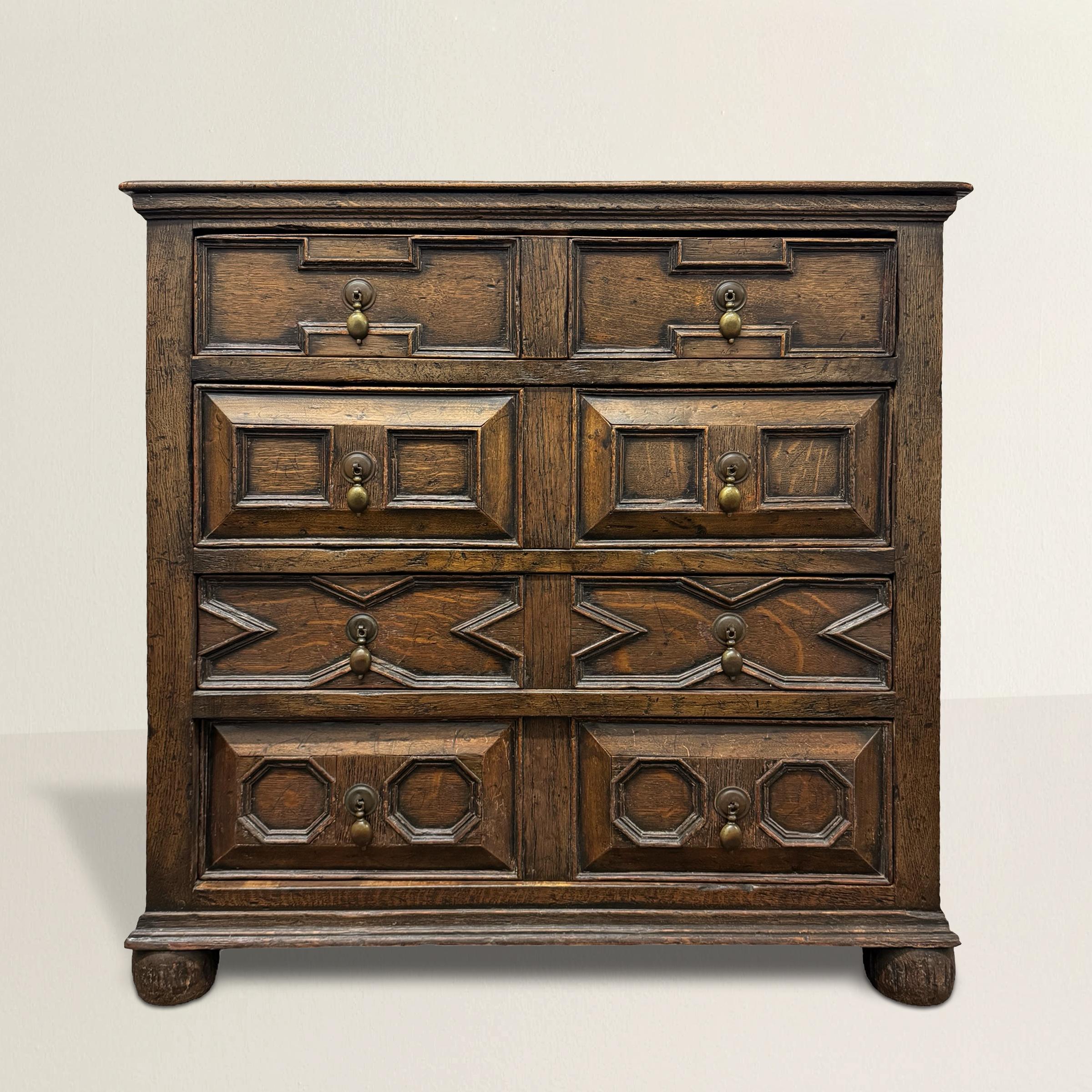 This 19th-century English William and Mary-style oak chest of drawers seamlessly marries functionality with elegance, boasting a hidden surprise within its classic design. The top drawer conceals a secret fold-out desk, offering a discreet workspace
