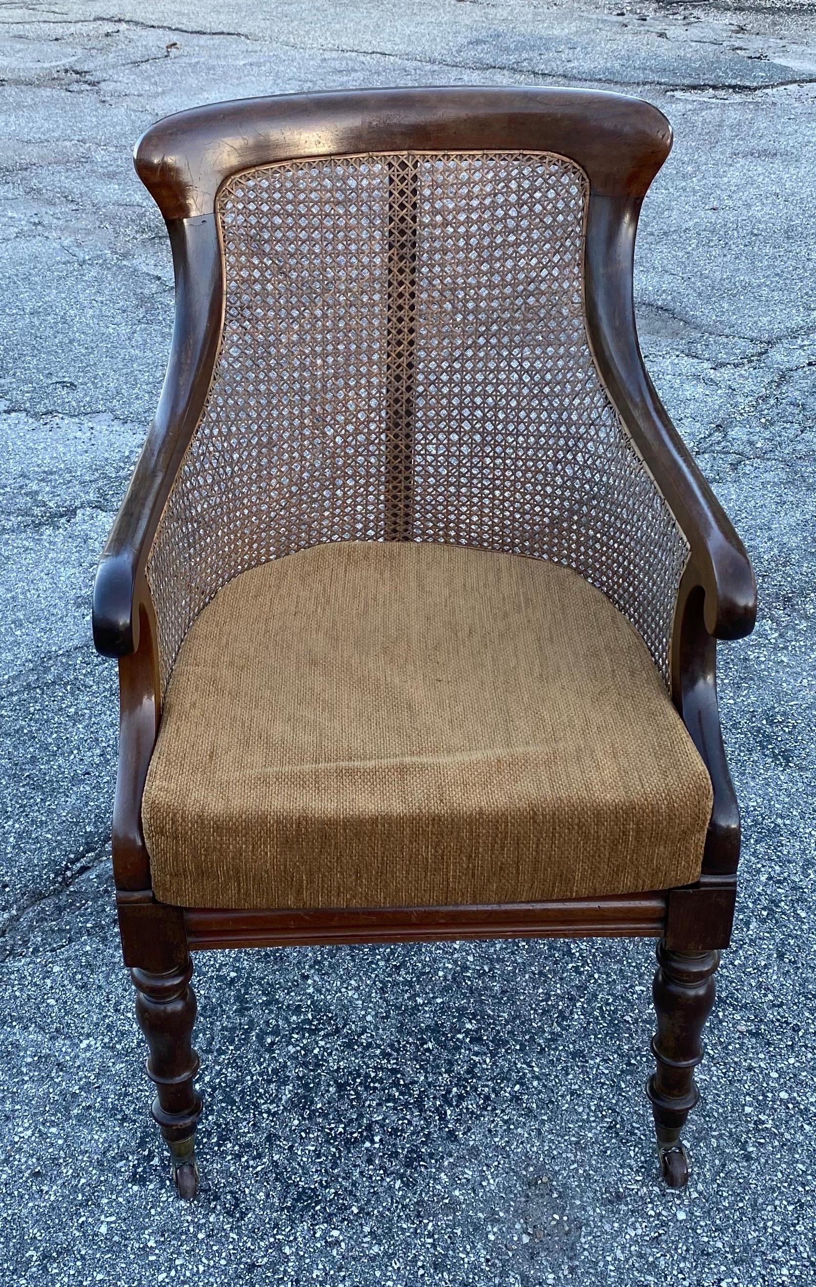 19th century English William IV mahogany library chair with original cane.