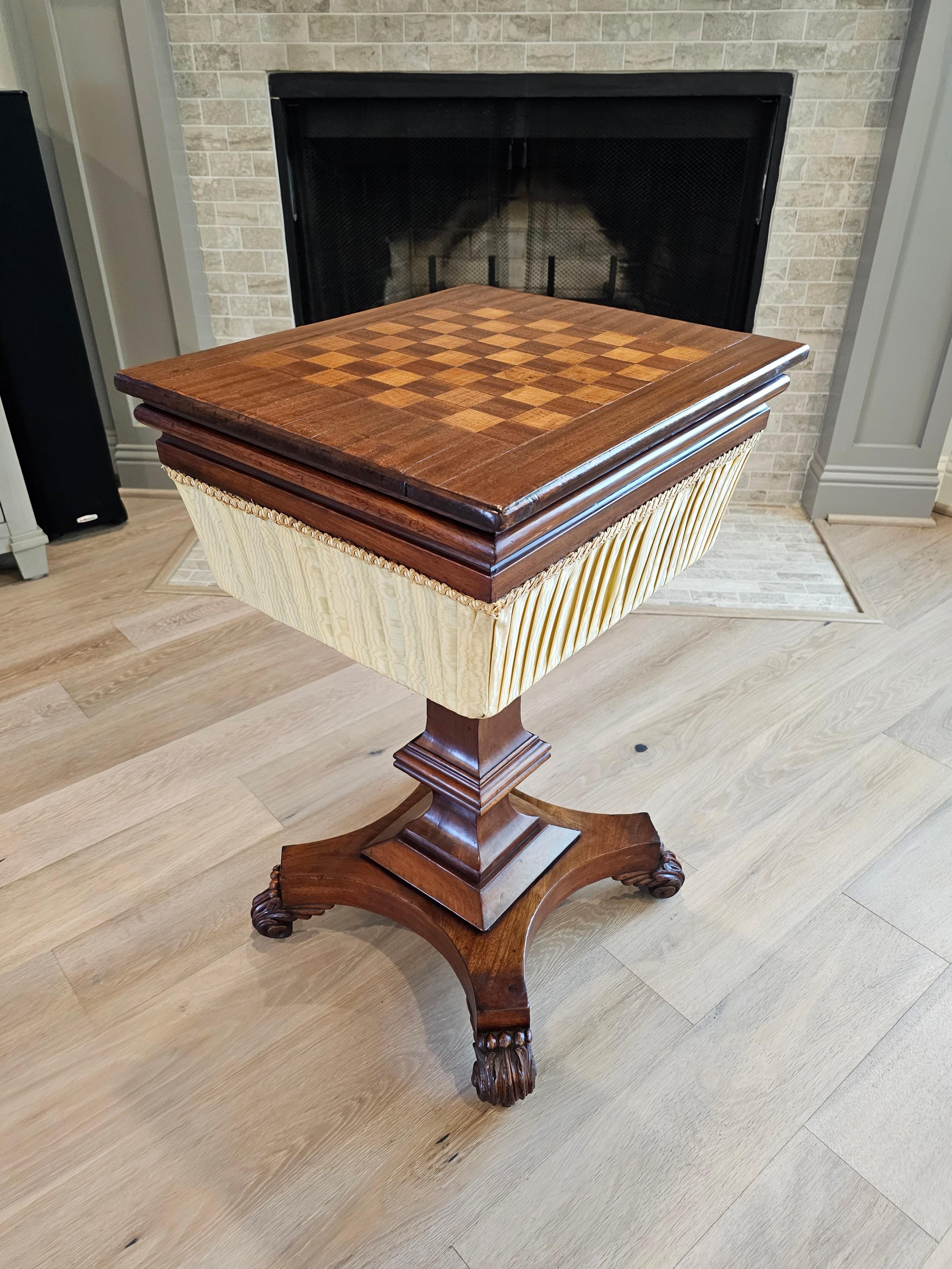 A period William IV English mahogany sewing stand work table with inlaid chessboard top. circa 1830s

Combining sophisticated elegance, warmth, and functional design, this outstanding example was born in England in the mid-19th century, exquisitely