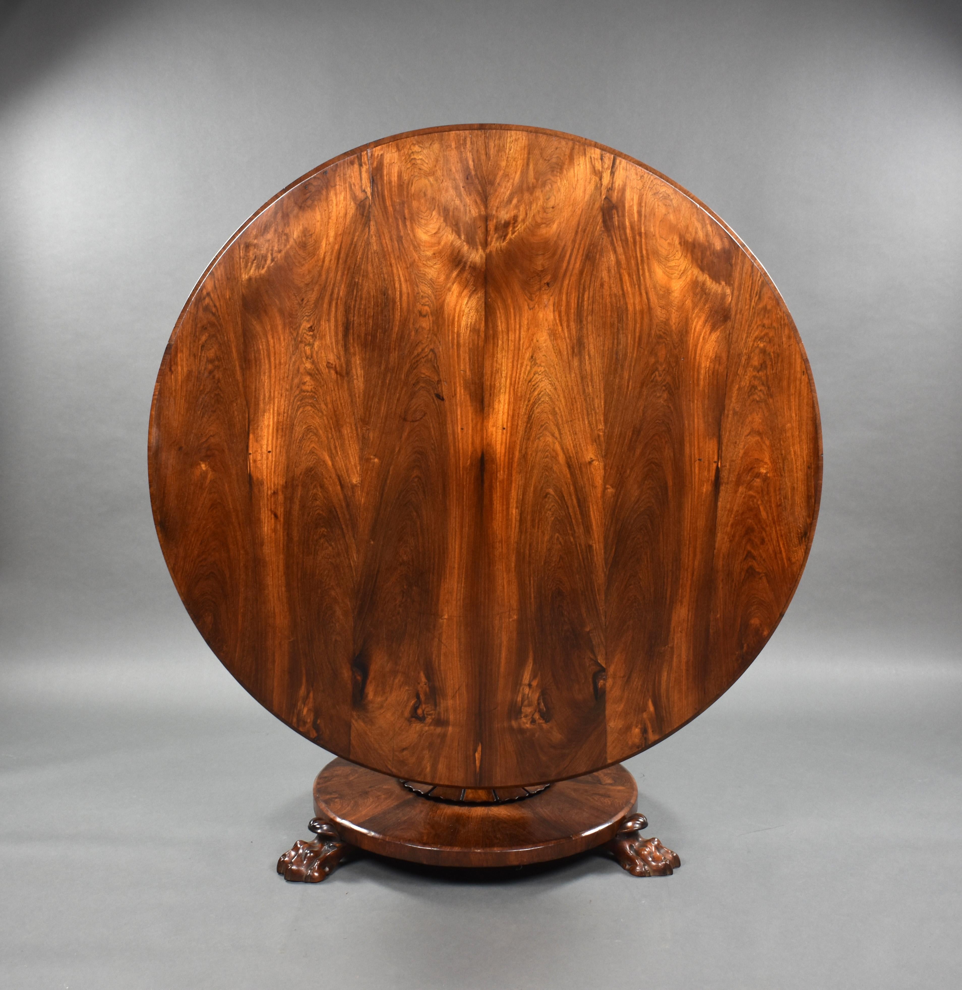 For sale is a good quality William IV rosewood circular breakfast table, having a well figured top above a turned stem, over a platform base raised on carved lions paw feet. The table is in very good condition for its age.

Measures: Width: 130cm