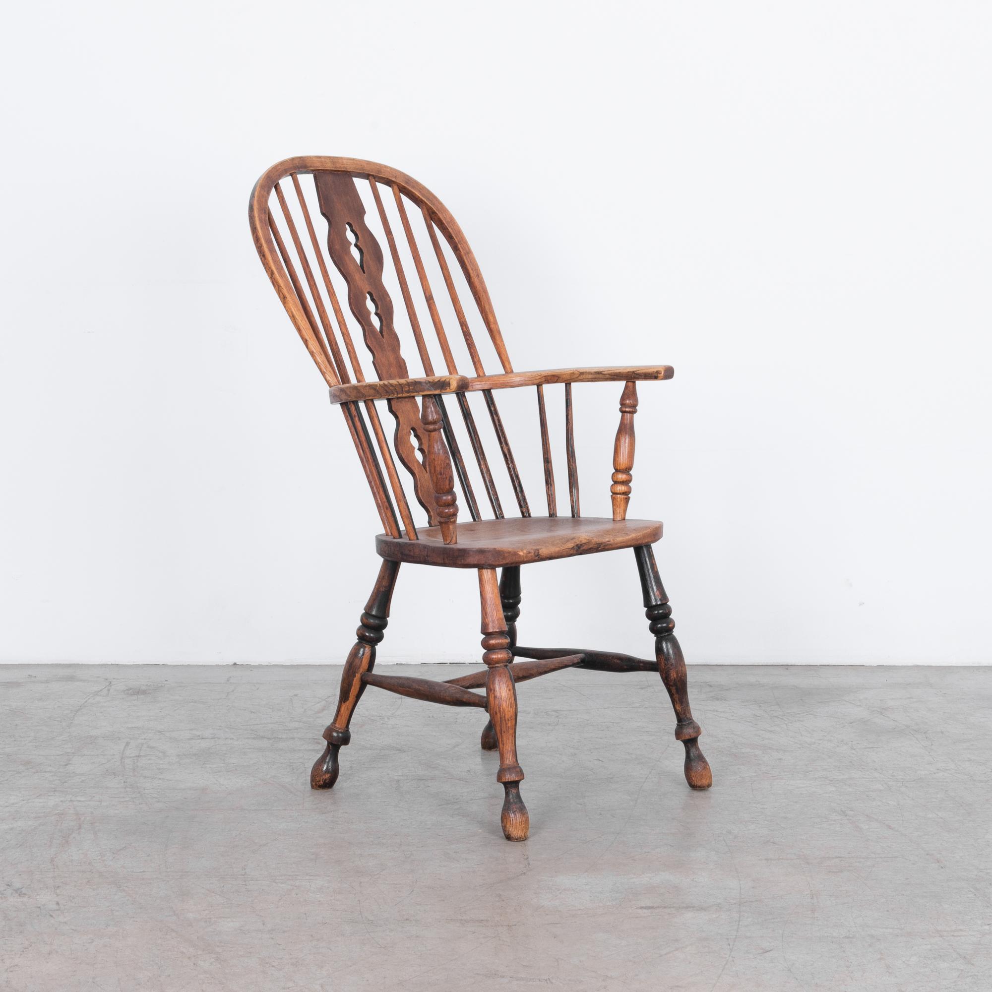 Gorgeous antique Windsor chair with unique pierced splat, ash frame with elm seat. A worn patina reminds us of its years of loving use. Expertly crafted by traditional artisans, a future heirloom.