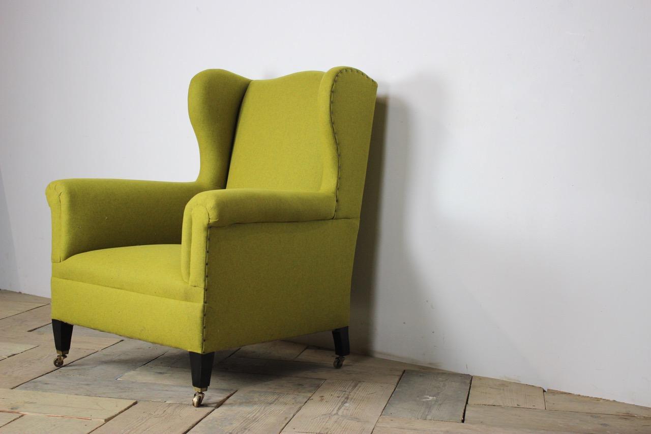 A good quality late 19th century English wingback armchair of good proportions, recently reupholstered by us in a green wool. 

Measurements: 99 cm high x 79 cm wide x 85 cm deep x 38 cm high (floor to seat ).
  