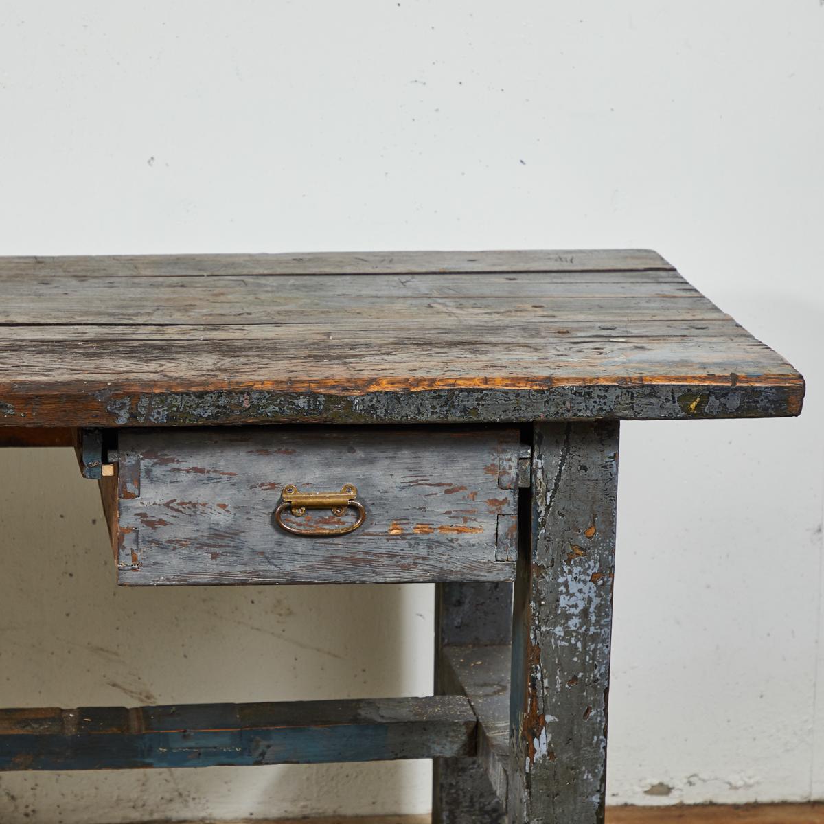19th century English wood plank top work table with great antique character. The table has one-drawer and straight legs joined by stretchers.