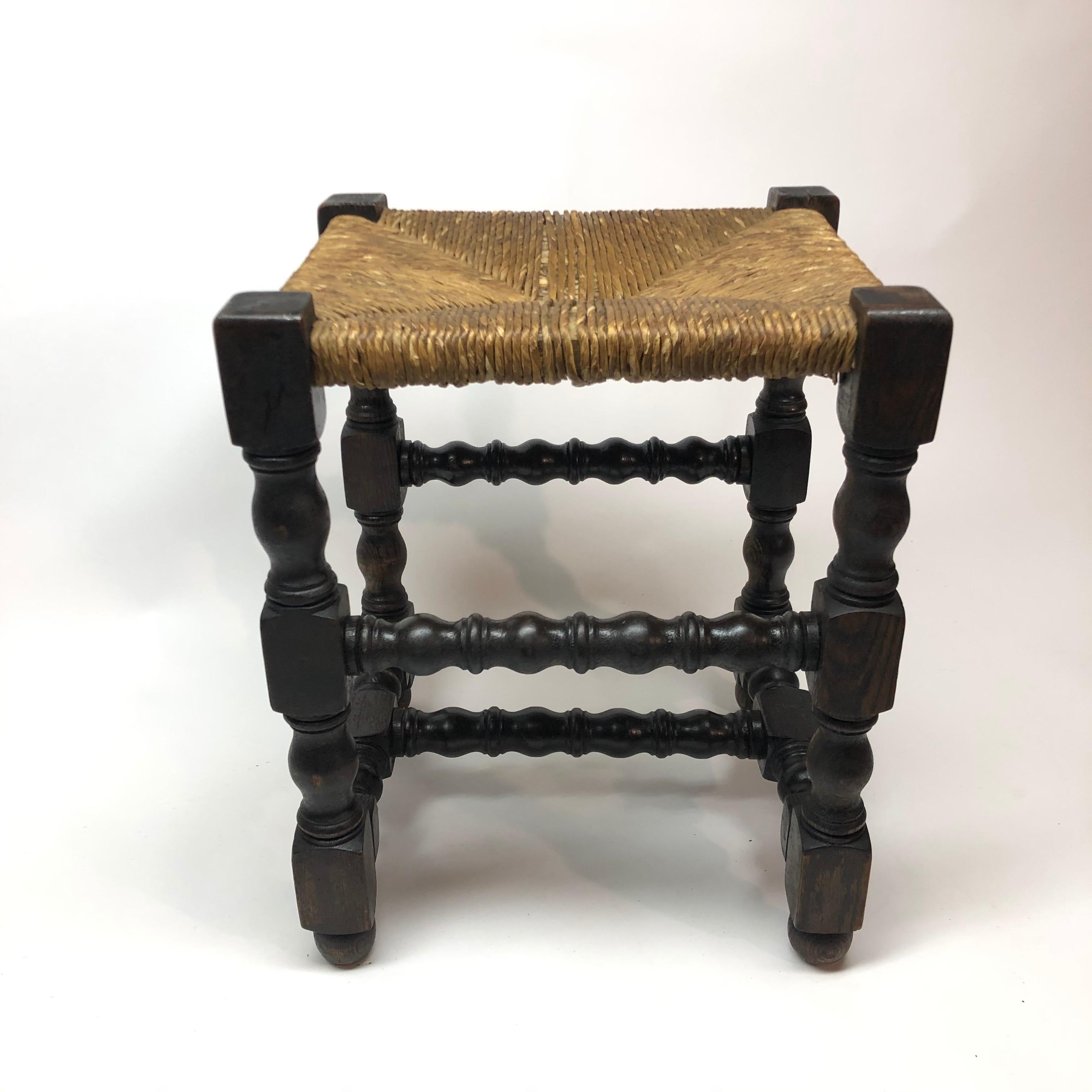 Antique English rush seat turned oakwood stool.