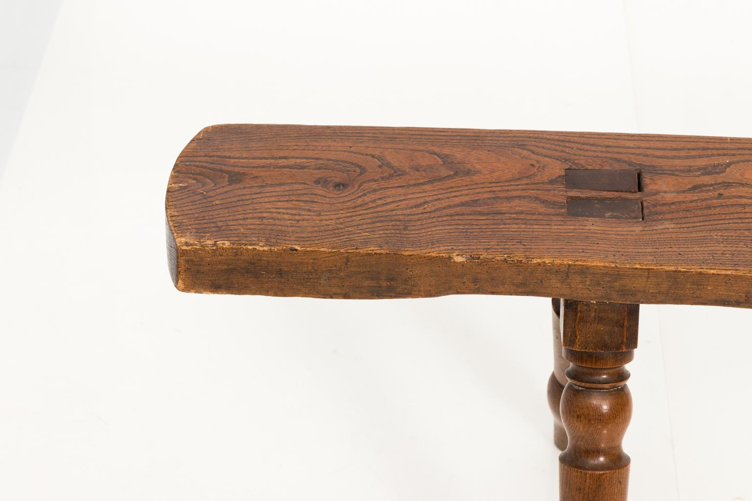 19th century English wooden hall bench with turned legs.
 