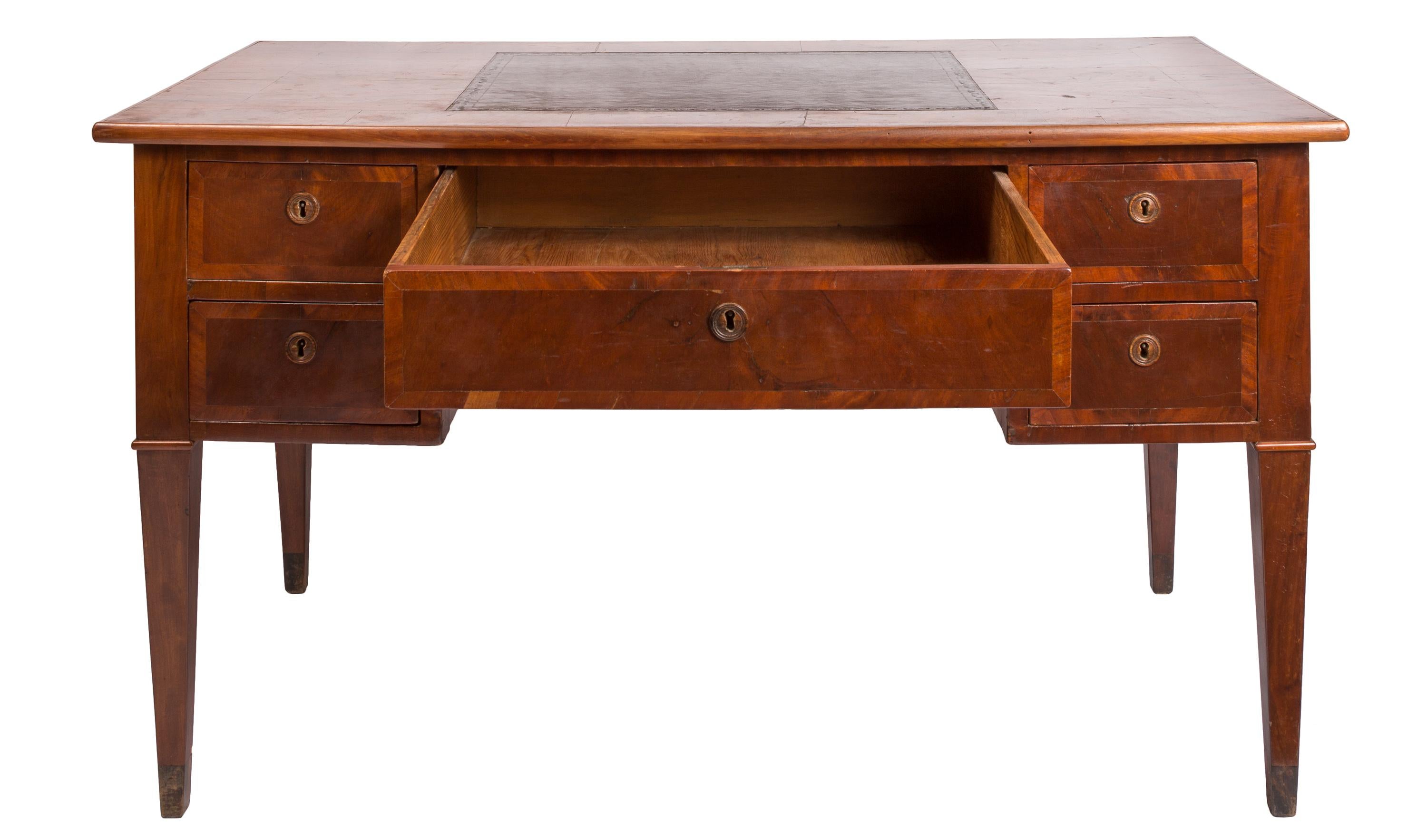 This mid-19th century English writing desk features handsomely inlaid rich-grained mahogany veneer. It is 