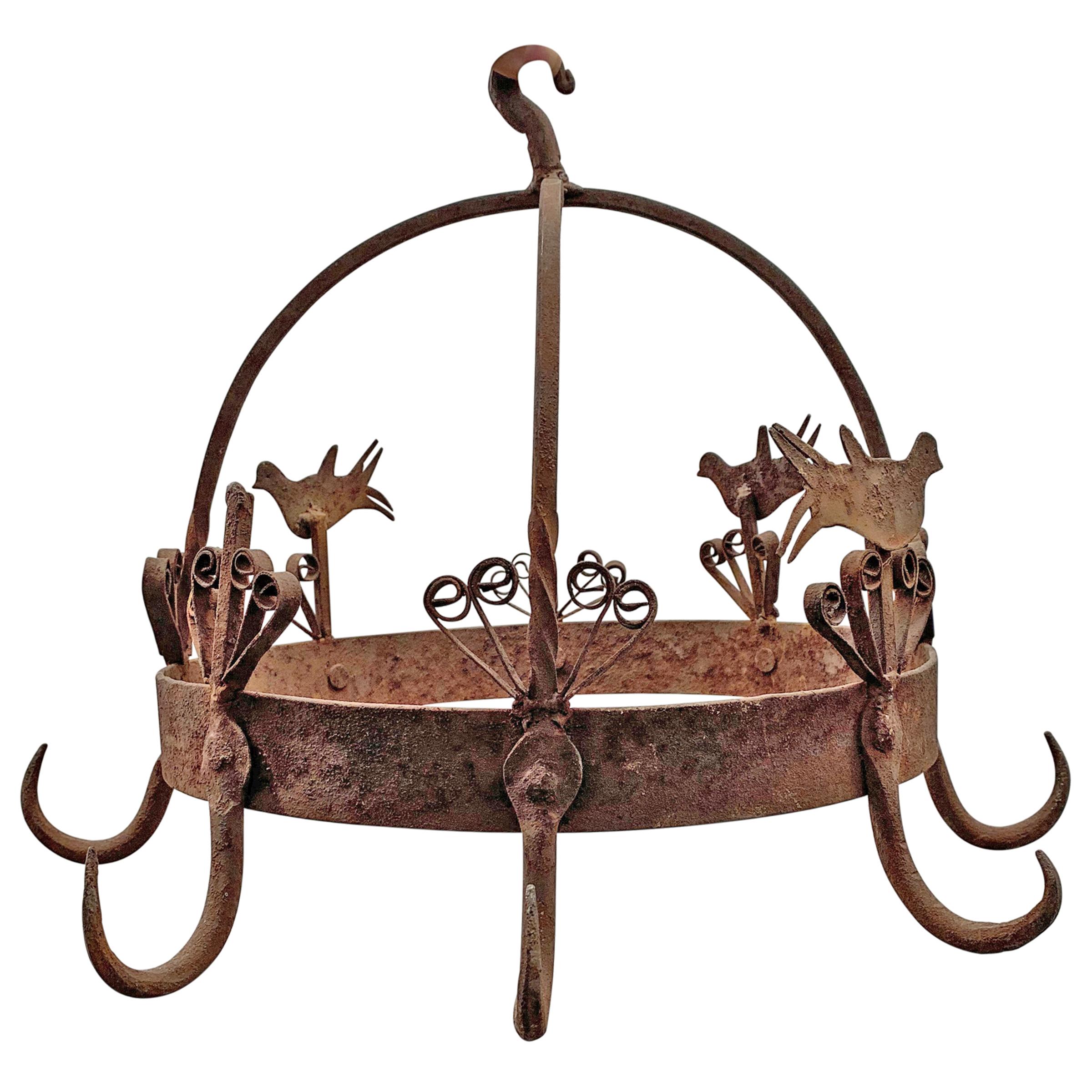 19th century English wrought iron game rack called a Dutch Crown with birds and stylized flowers surrounding the crown. Perfect for hanging herbs and flowers to dry.