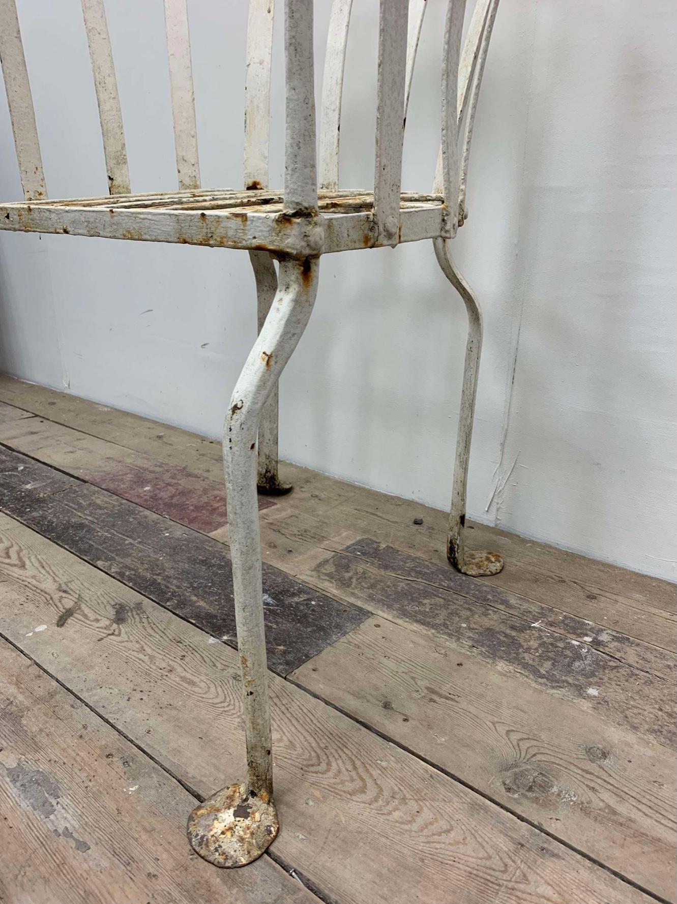 Forged 19th century English wrought iron garden chair with curved back For Sale