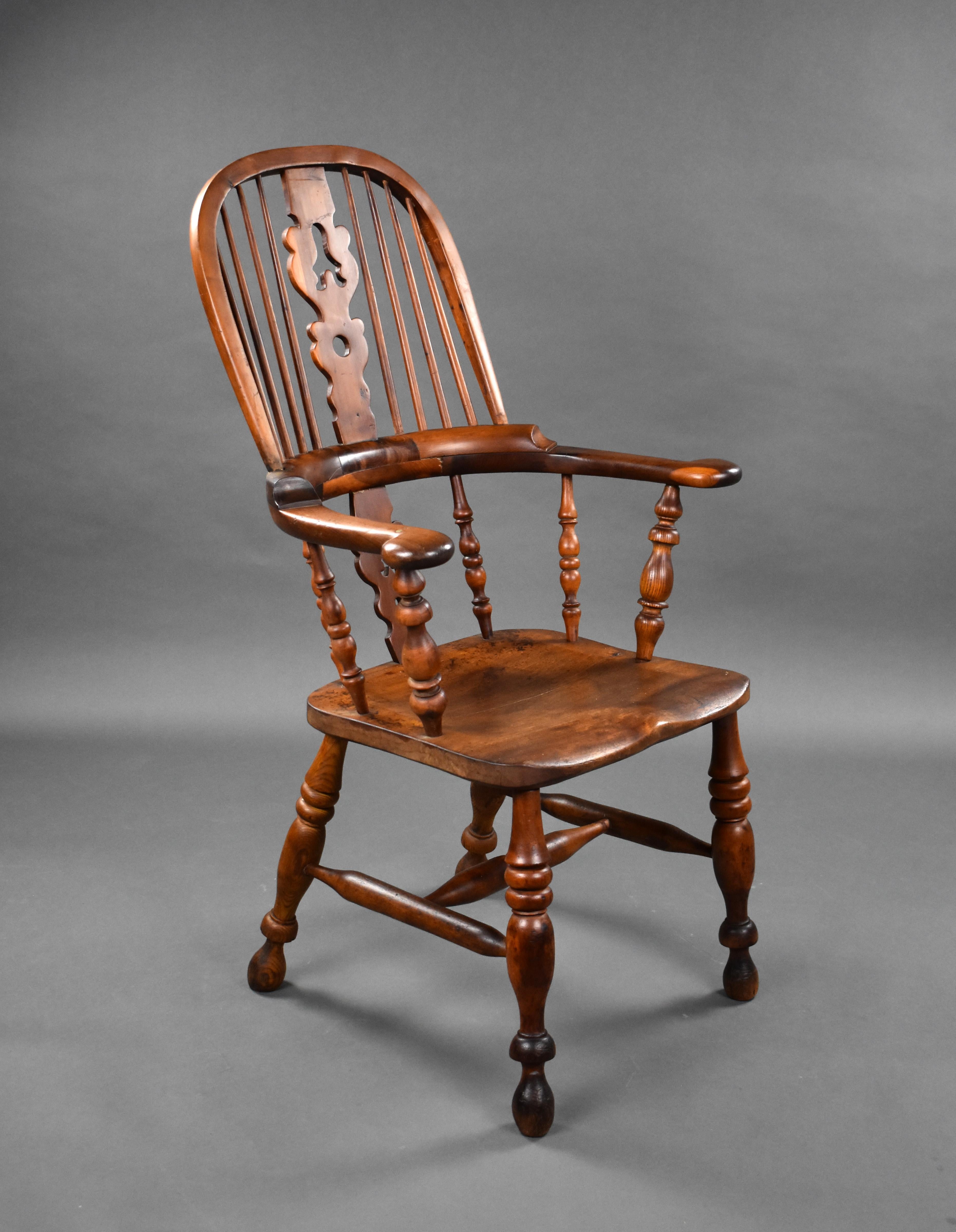 A good quality 19th century yew wood broad arm Windsor chair, having a high back and an elm seat, the chair remains in good condition, showing minor signs of wear commensurate with age and use. 

Measures: Width: 65cm depth: 53cm height: 108.5cm.
