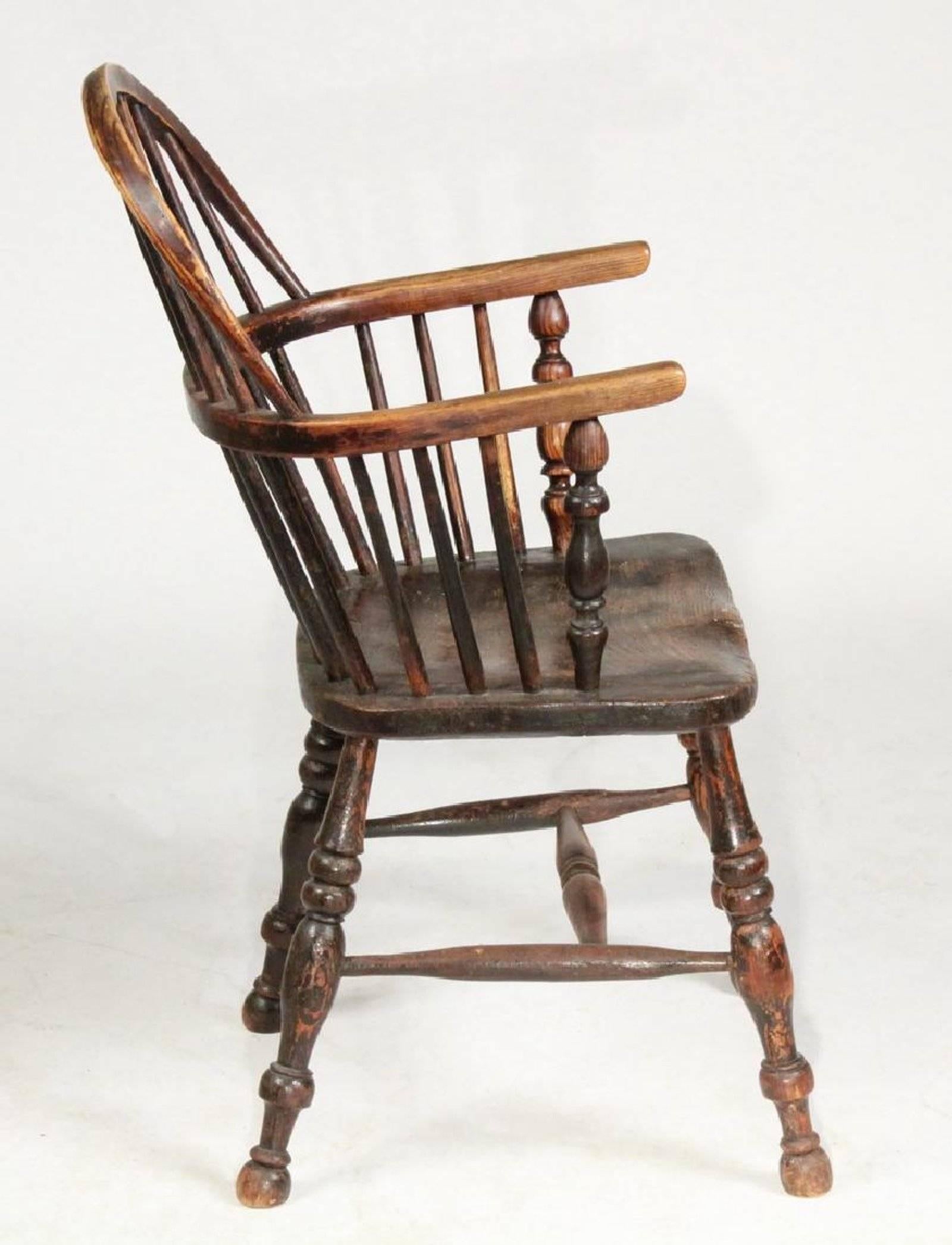 19th century rustic English bow-back Windsor chair; yew wood, bentwood and spindle back, pierced centre splat, turned supports for arms, bodged seat. 

*Typical of the chairs made in or near High Wycombe before making Windsors there became factory