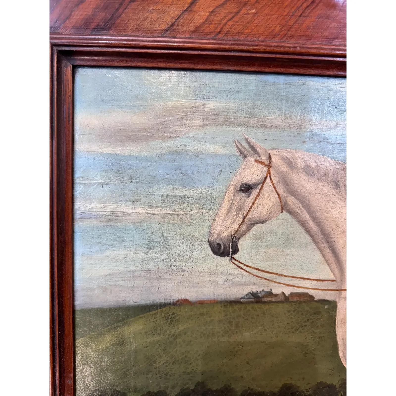 This 19th century english painting of a grey horse is perfect for a horse lover or simply someone who admires a beautiful painting. The horse, standing in front of the woods, is saddled up for its rider on a clear day. The sturdy frame is as