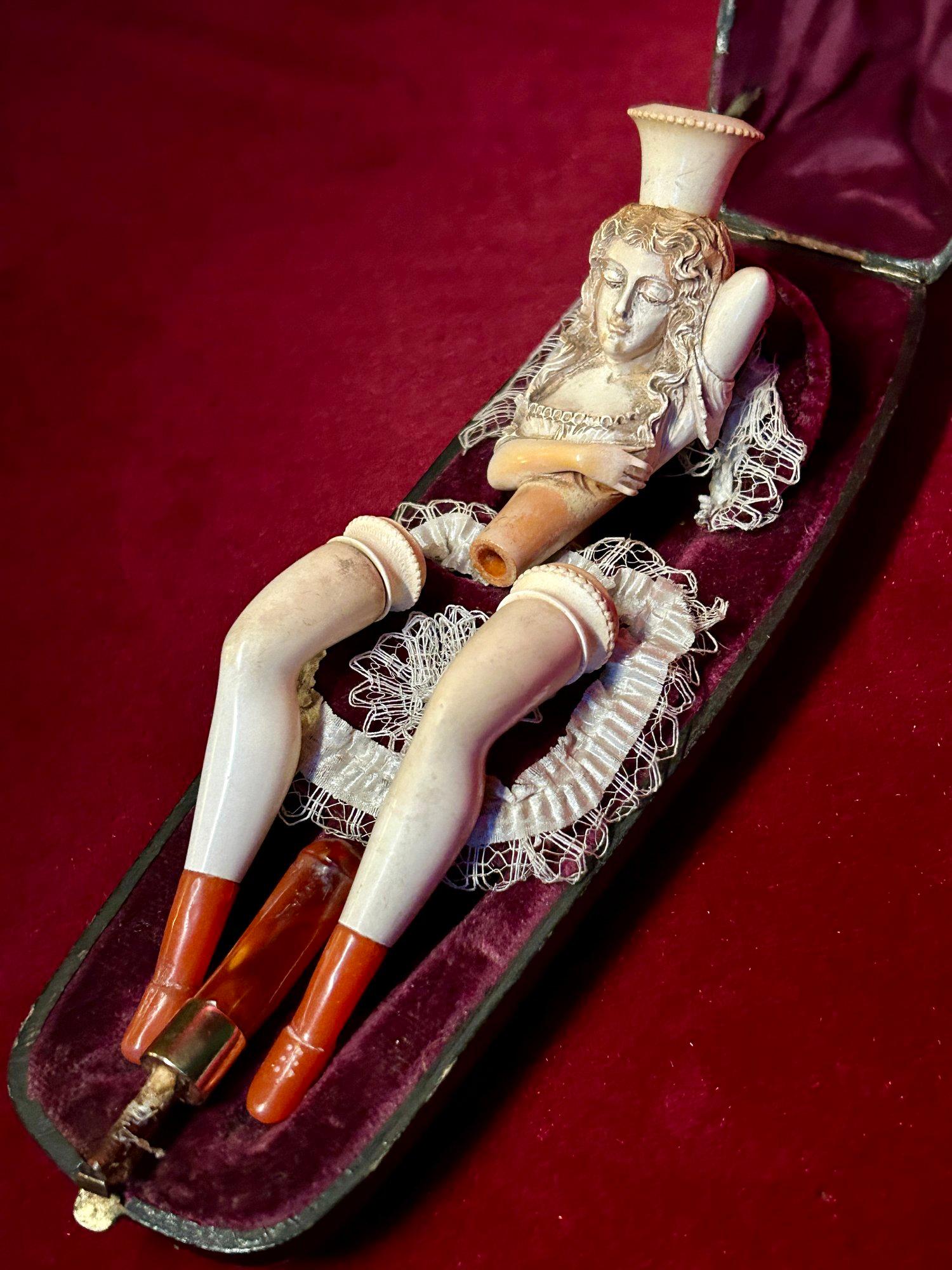 Antique Meerschaum Pipe, Erotic Meerschaum Pipe, Erotic Antique, Cabinet of Curiosities, Antique Cheroot Holders, Romantic Antique.

Rare late 19th Century erotic Meerschaum Pipe in the form of a woman laying in a bed decorated diorama case, with