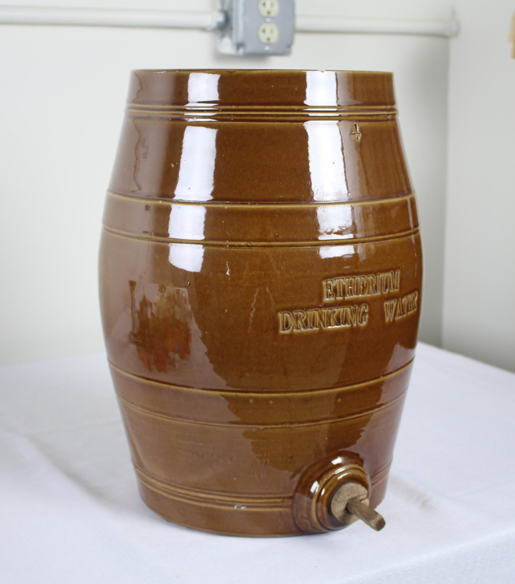 This type of crock is quite rare in the 4 gallon form. An unusual piece of history, the piece was used to dispense ether diluted in water. On the front of the crock can be seen the words 