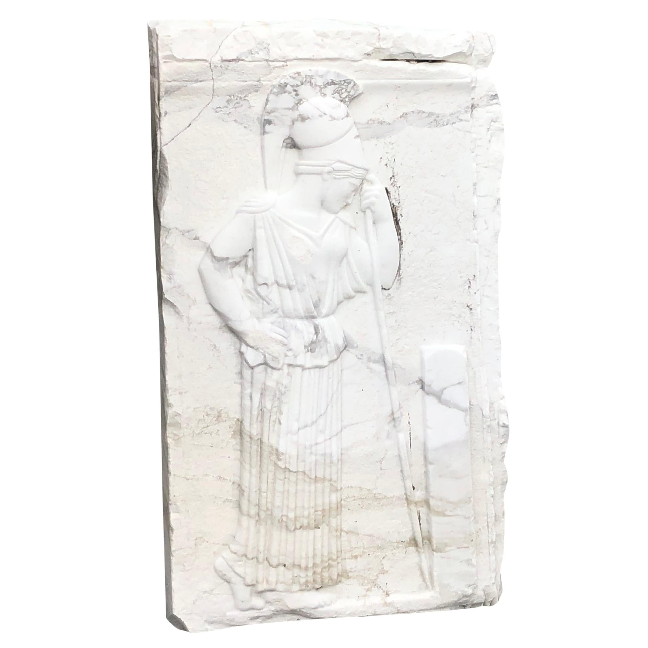 An antique marble relief of Athene or Athena who was a goddess of Greek mythology, in good condition. She stood for Wisdom, strategy amongst many and gave her name to to the Capital of Greece Athens. She belongs to the Twelve Olympic Gods. Her main
