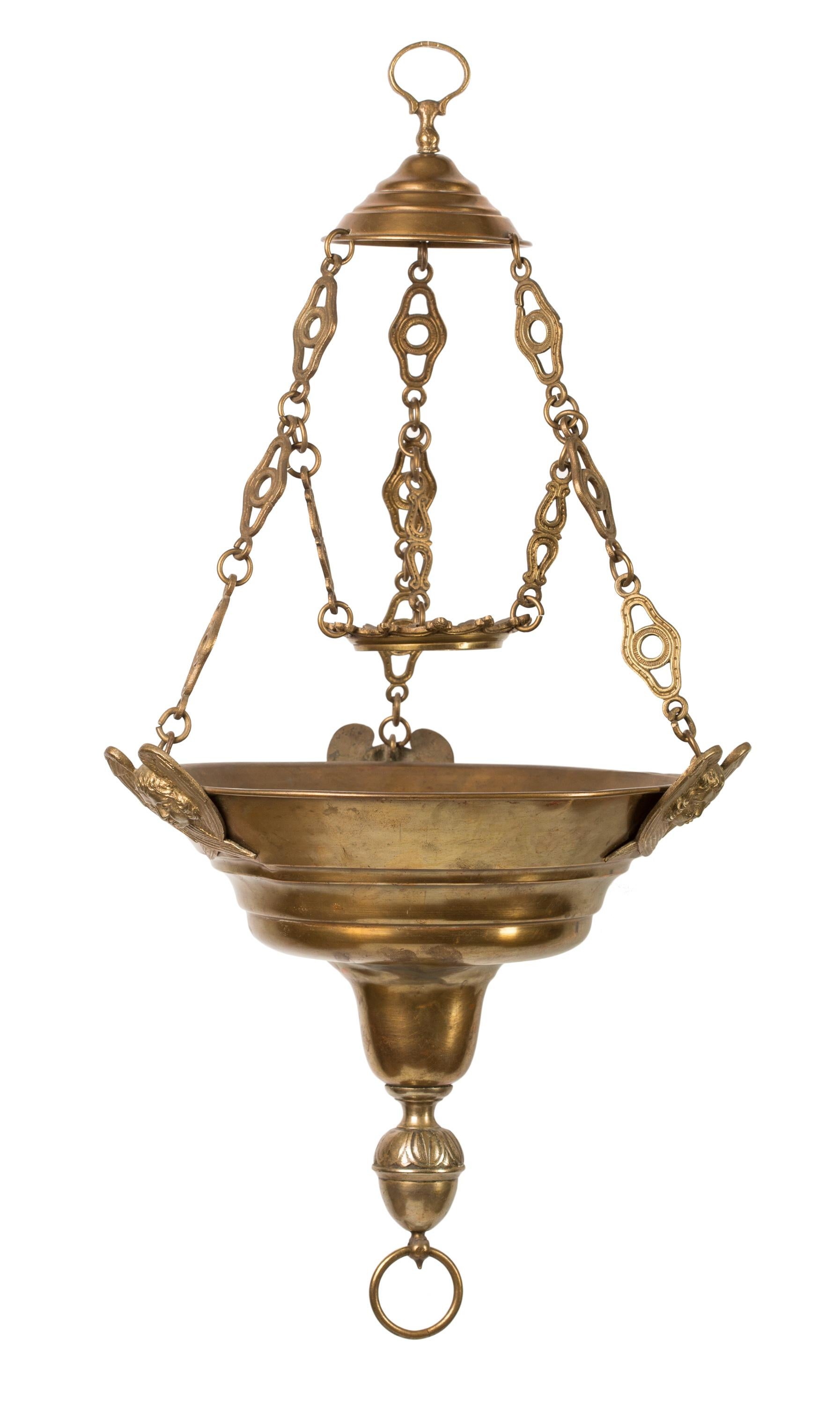 This 19th century brass hanging pendant sanctuary lamp is from a Spanish collection, but it shares characteristics with French sanctuary lamps of the same period. The overall shape is reminiscent of the suspended oil lamps of ancient times, and