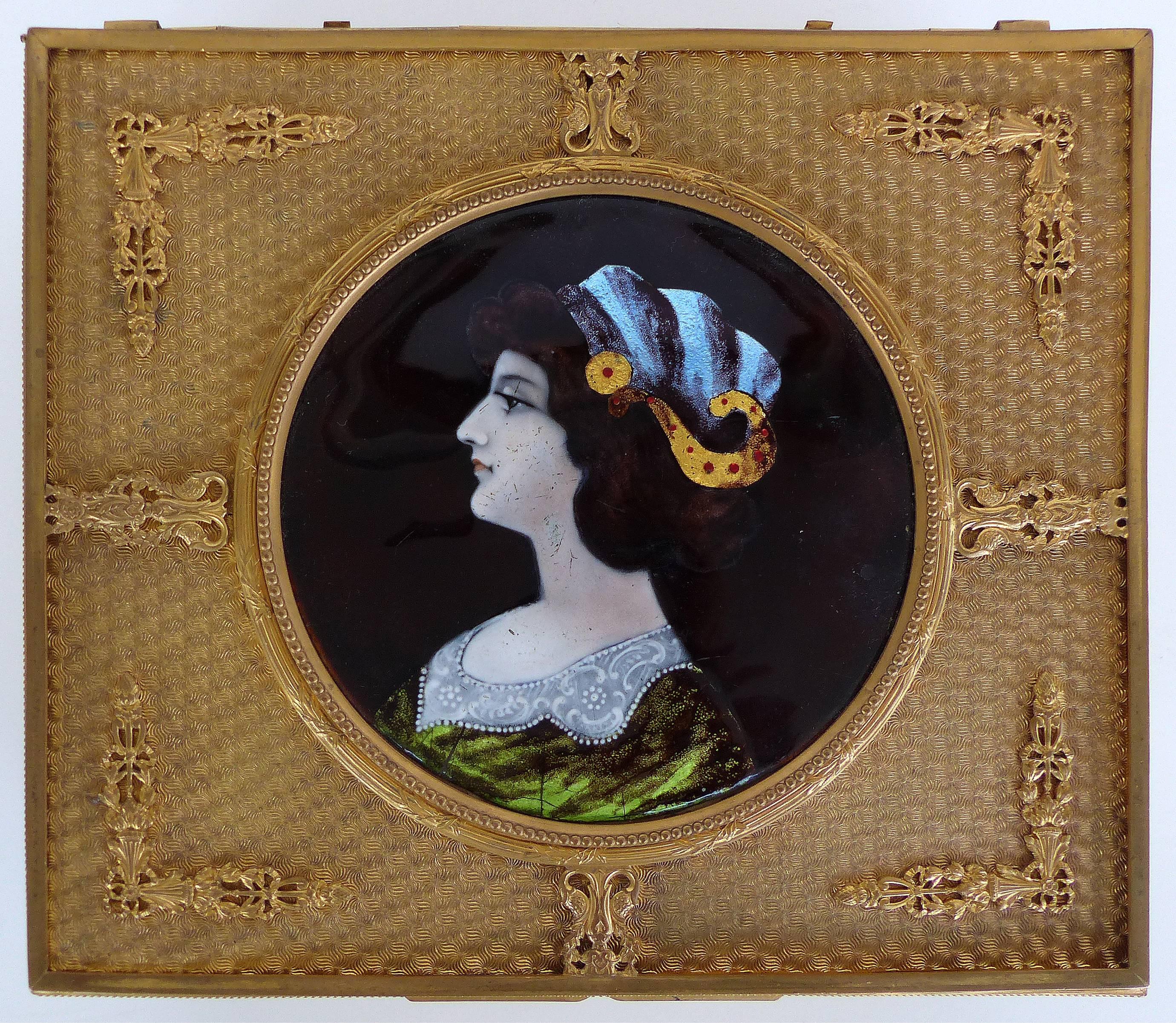 19th Century European Gilt Bronze Dresser Box with Enamel Plaque

Offered for sale is a late 19th century gilt bronze dresser box that has an inset hand-painted enamel portrait plaque. The box is fabric lined and supported by four feet. The frame is