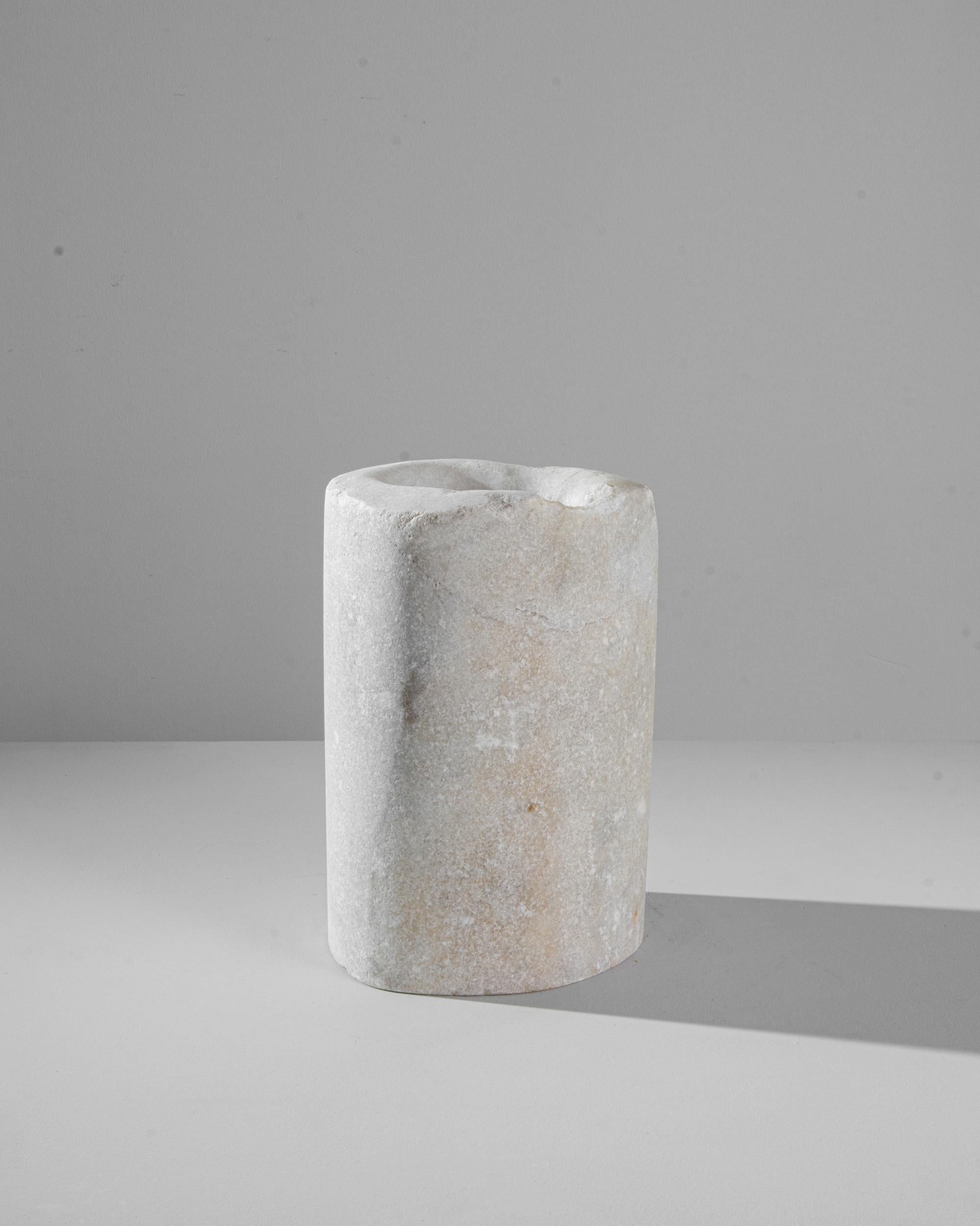 Indulge in the charm of a bygone era with this 19th Century European Marble Mortar. Its unique shape, shaped by the passage of time, tells a story of centuries past. Crafted from enduring marble, this mortar not only stands as a testament to