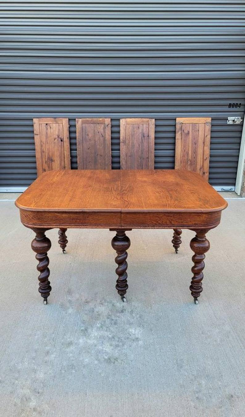 A rare and most impressive European dining table from the second half of the 19th century.

Fit for a Victorian farmhouse or country English castle, this magnificent table features an expandable solid wooden frame that extends to over a palatial