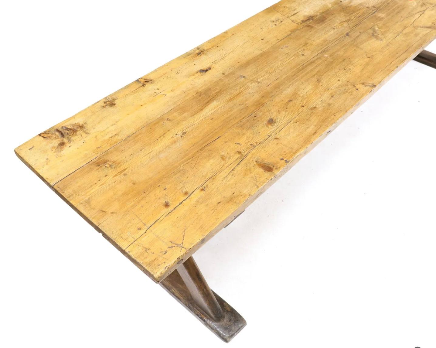 Antique Continental Pine Ten-Foot Farm or Trestle Table, Early 19th century. Two board rectangular pine top, two X-stretcher bases with chamfered corners, flat beveled shoe foot and iron trestle supports. Wonderful old scrubbed surface. 
